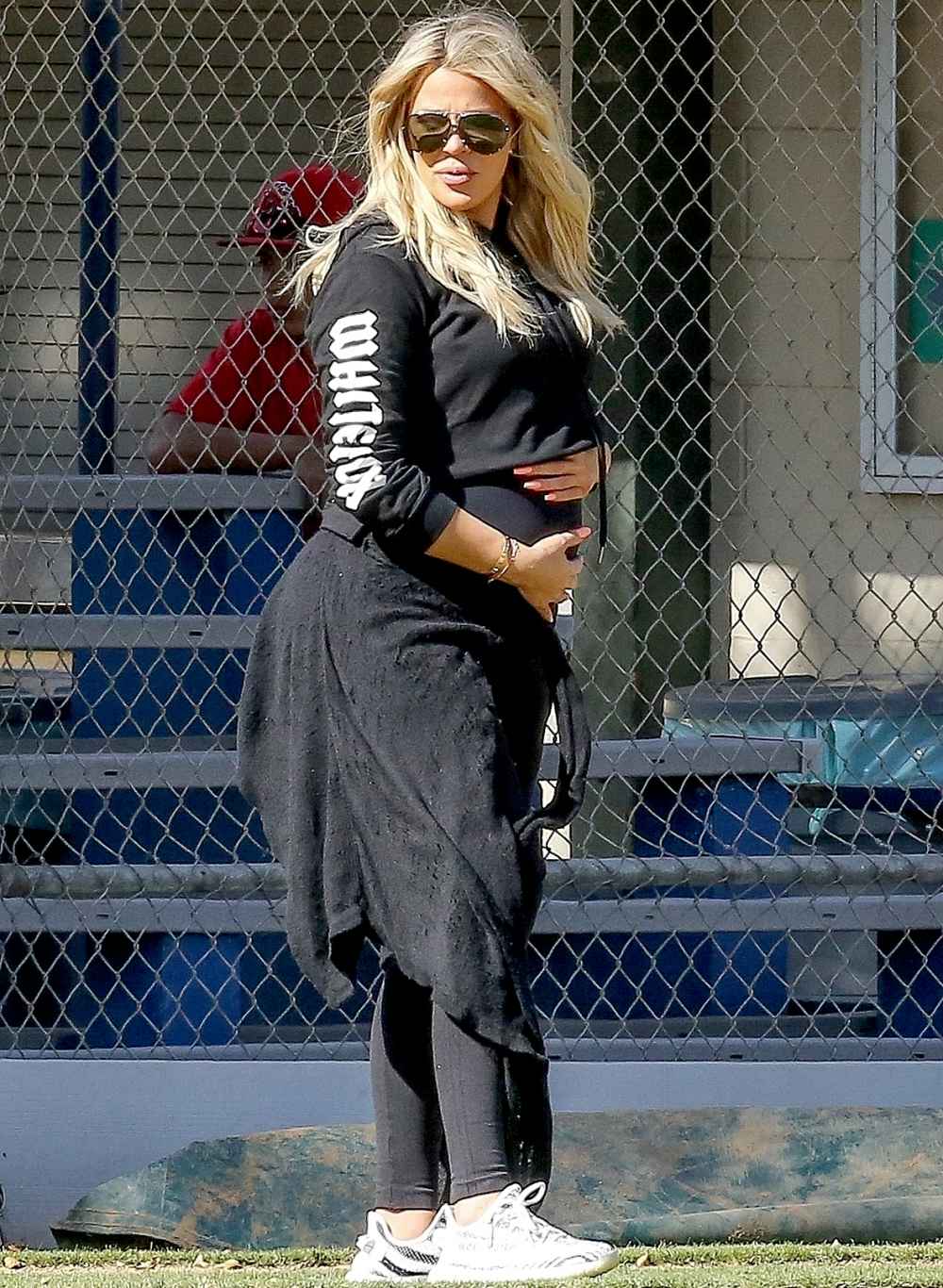 khloe-kardashian-cradles-bump