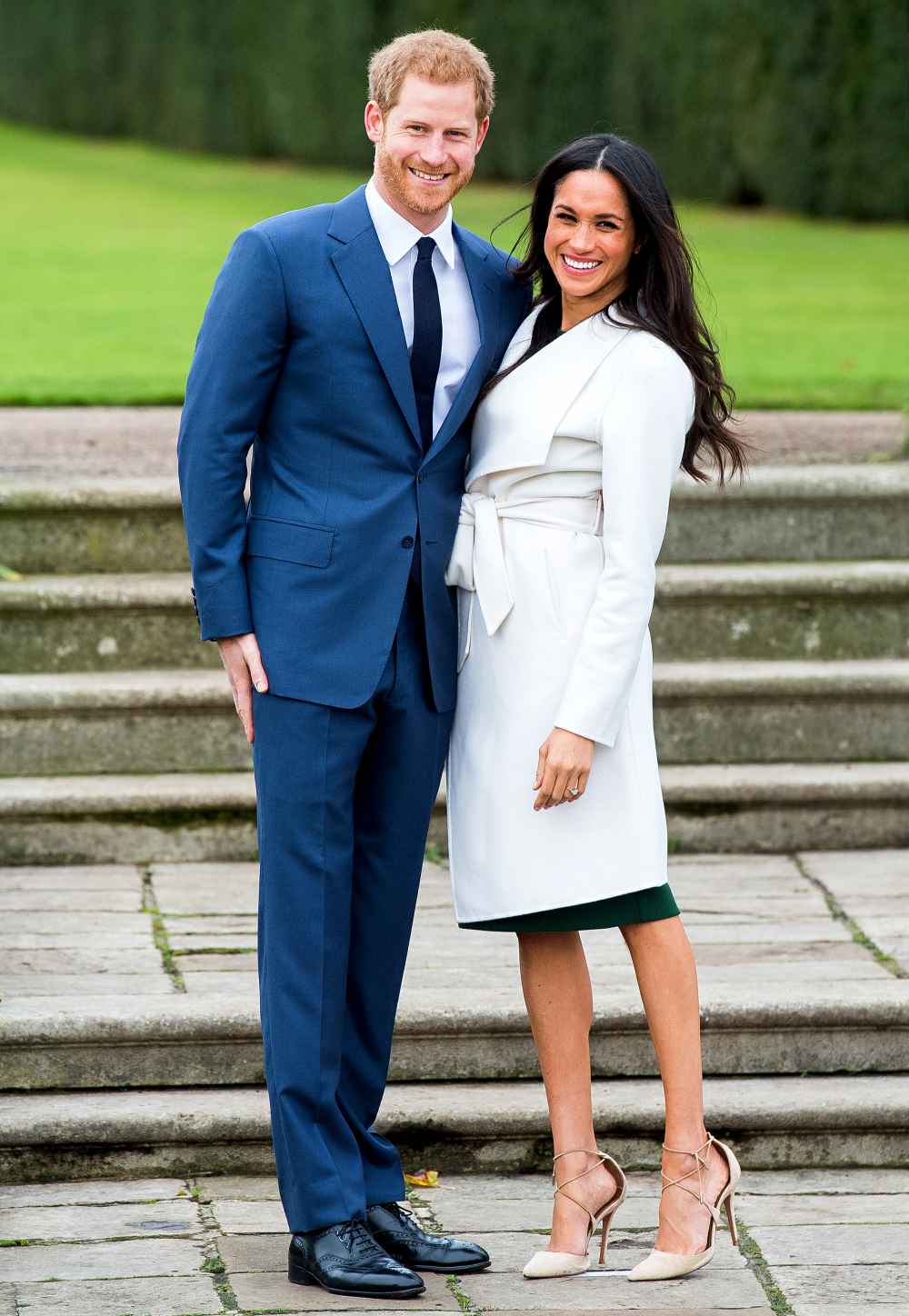 Prince Harry and Meghan Markle during an official photocall to announce their engagement at The Sunken Gardens at Kensington Palace on November 27, 2017 in London, England.