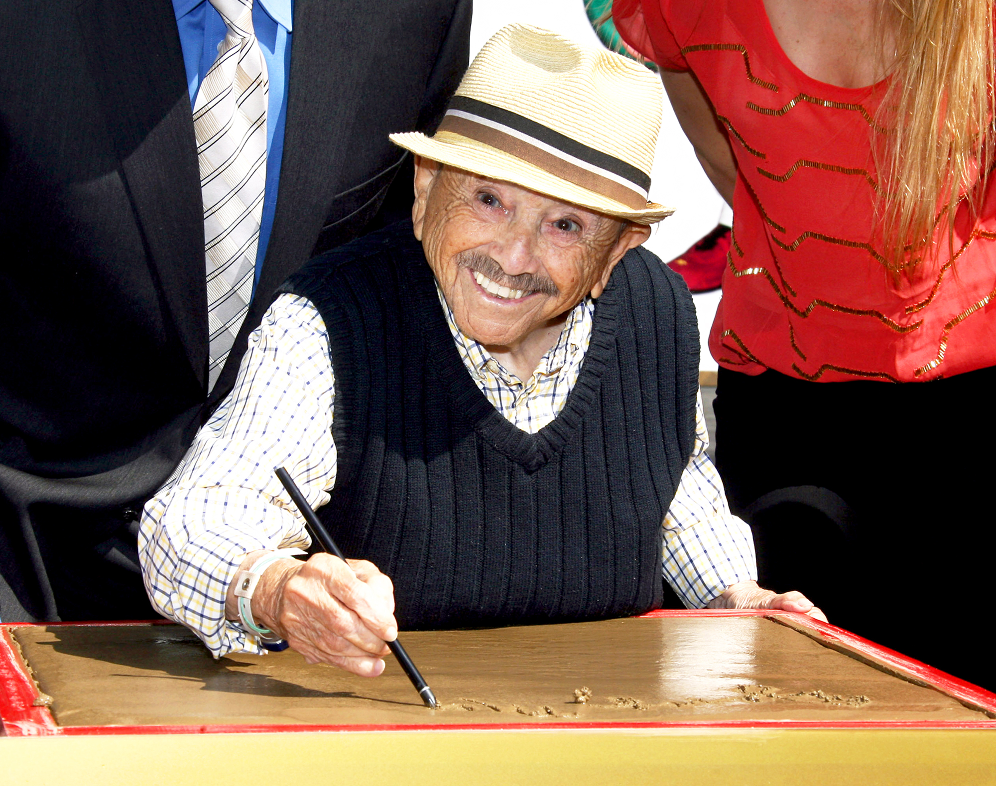 Jerry Maren attends the handprint-footprint ceremony for "The Lollipop Kid" last of the Munchkins from "The Wizard Of Oz" the at TCL Chinese Theatre Imax in Hollywood, California.