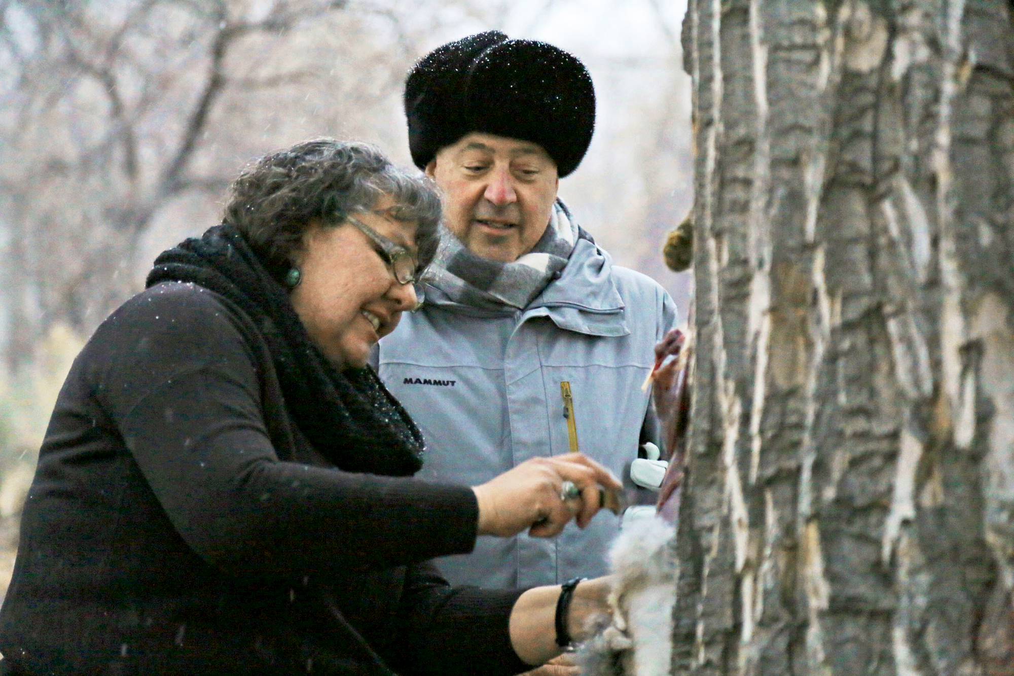 Andrew Zimmern watches Donna Cossette skin a wild jackrabbit in preparation for a native Paiute meal near the Pony Express Trail in western Nevada.