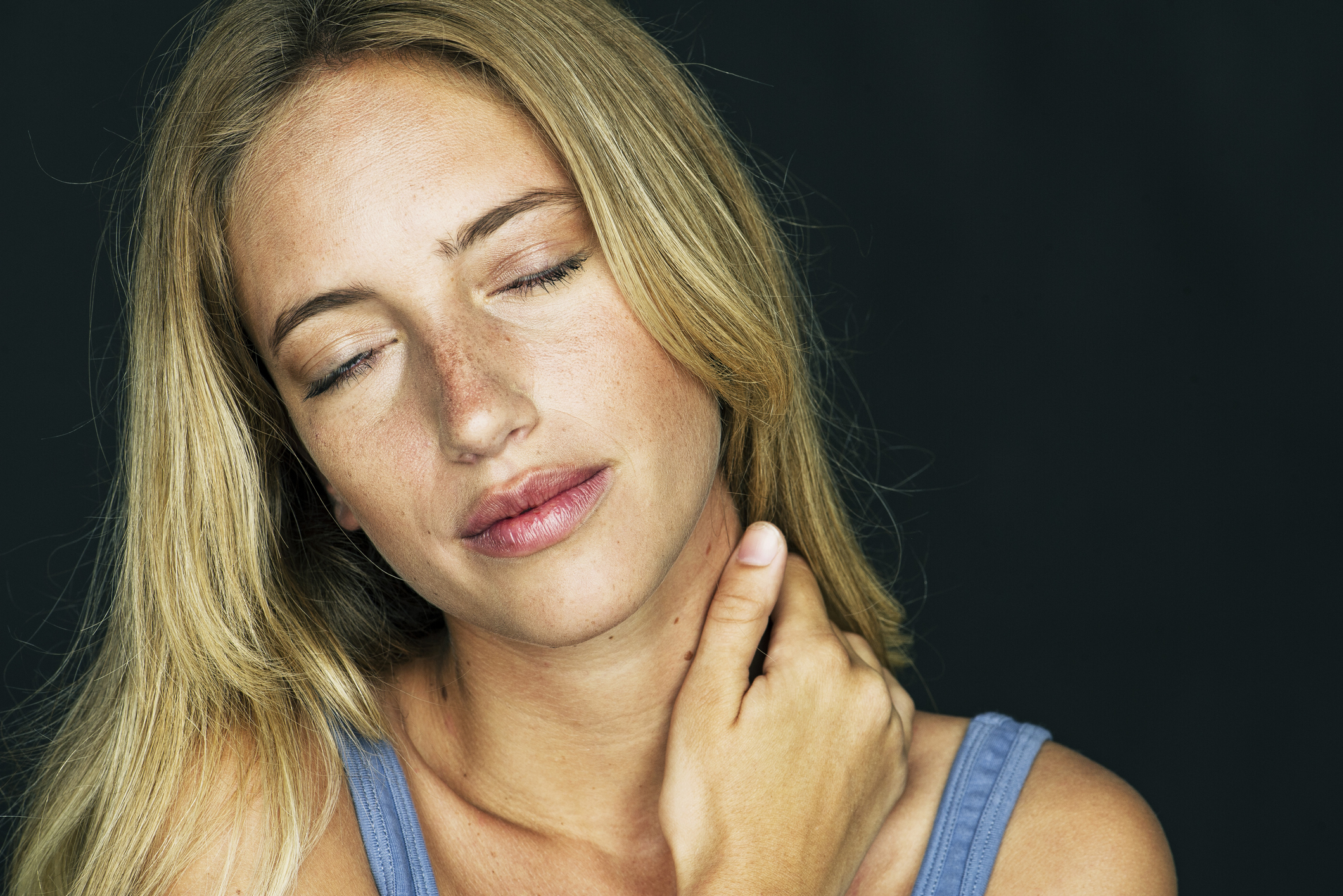 Woman massaging her neck