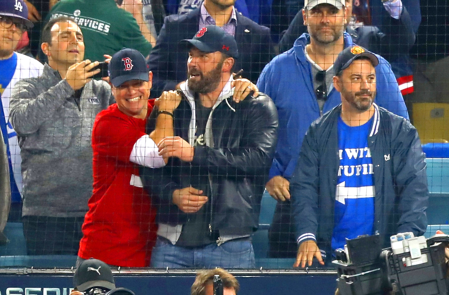Jimmy Kimmel (R) looks on as Matt Damon and Ben Affleck celebrate the Boston Red Sox winning the World Series v The Los Angeles Dodgers.