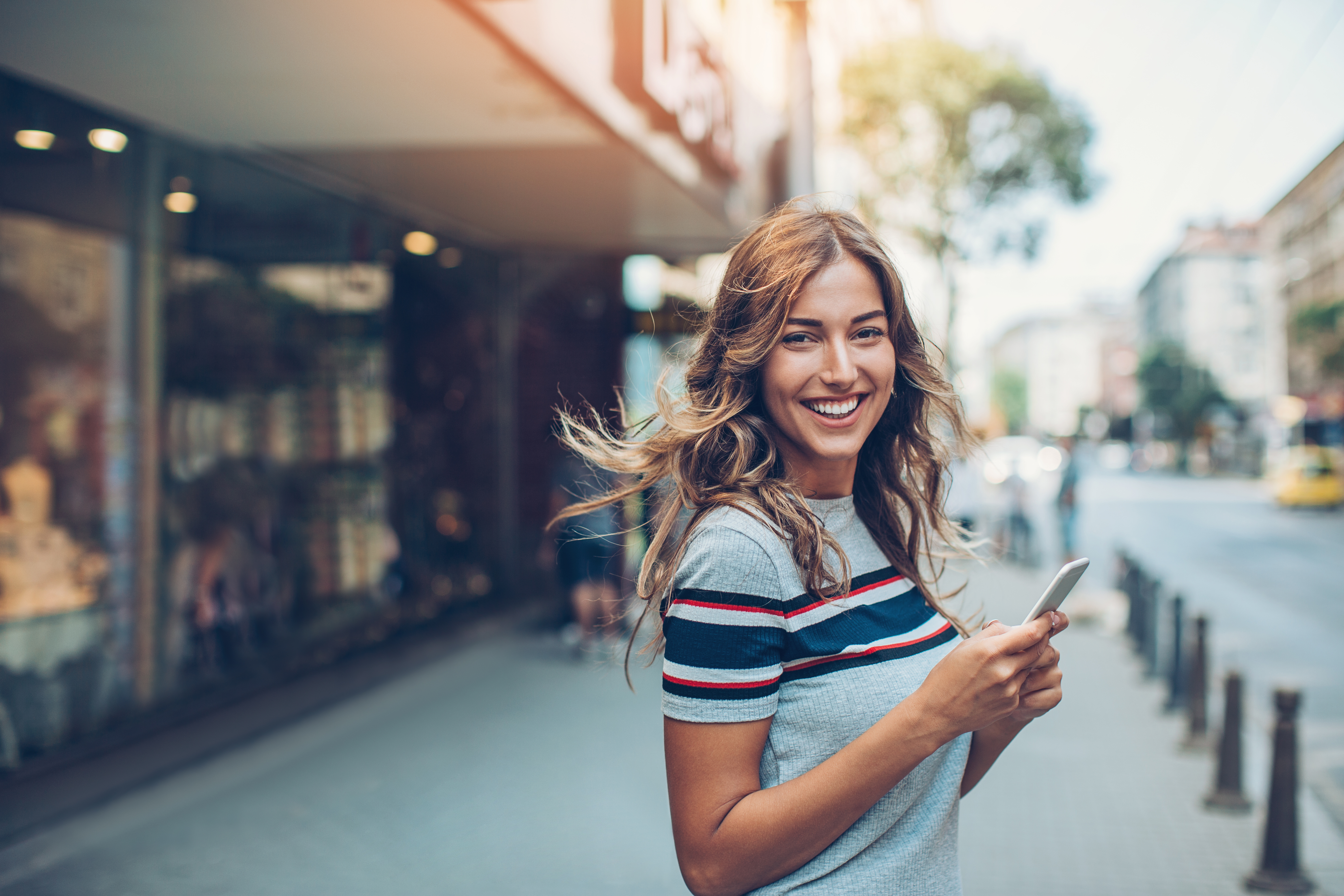 Beautiful city girl with smart phone