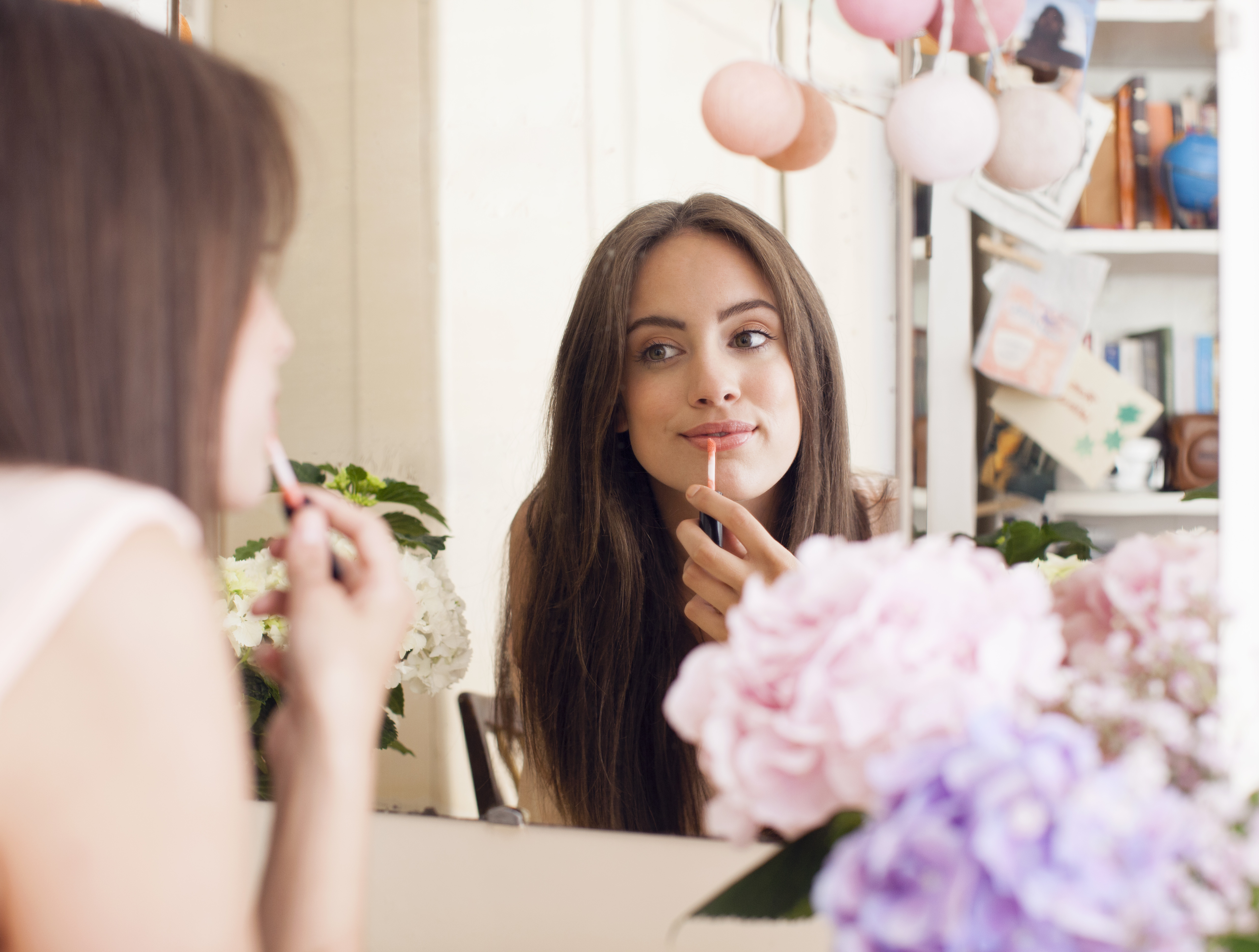 woman applying makeup