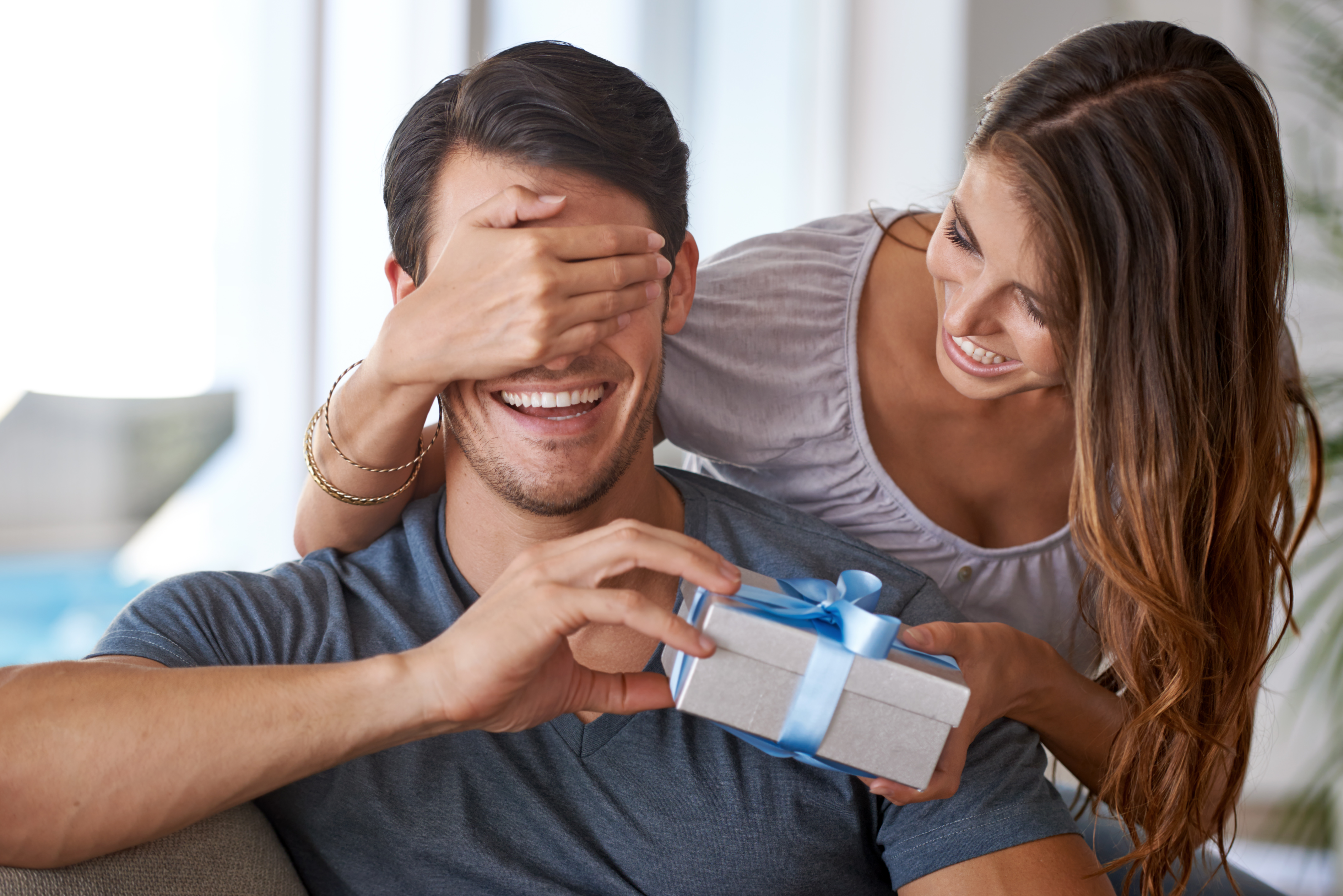 woman giving partner present