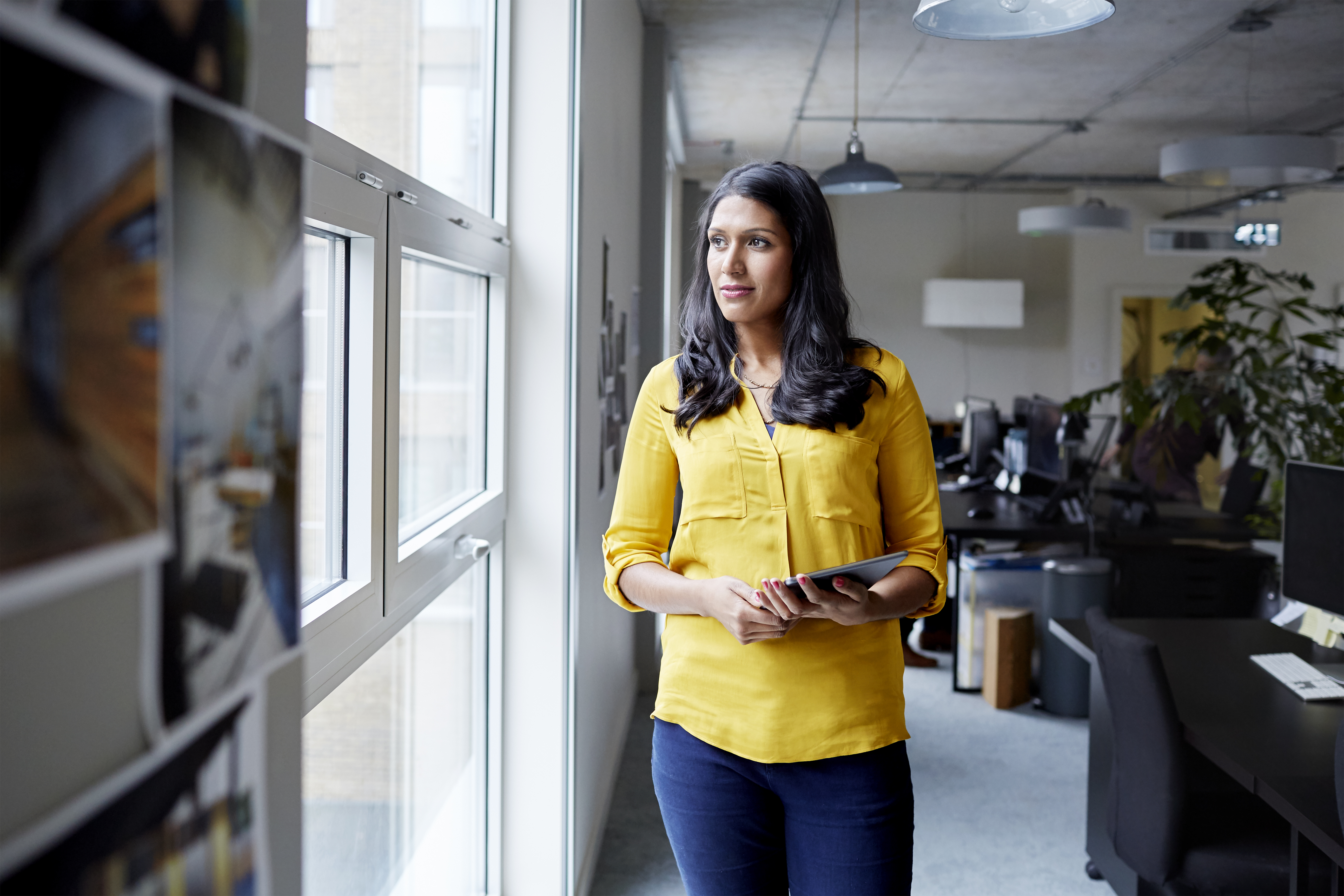 Portrait of a female office worker with tablet