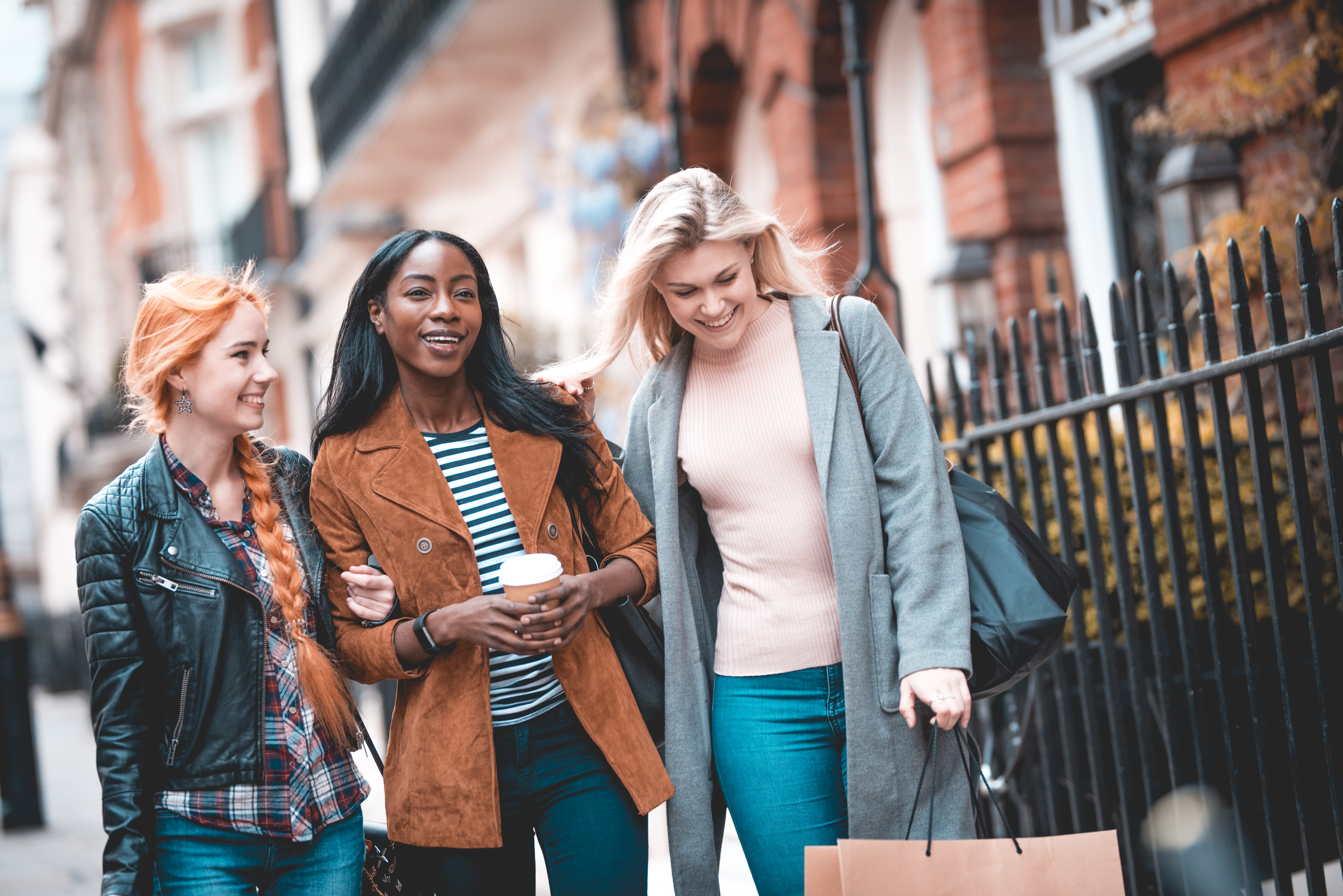 women carrying shopping bags