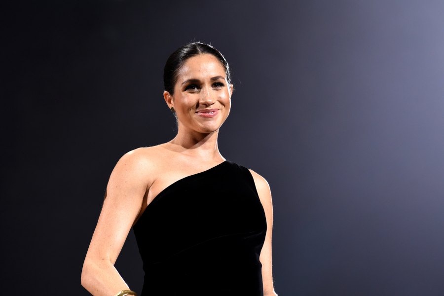 Pregnant Duchess Meghan Stuns in Black, Cradles Her Baby Bump at 2018 Fashion Awards: Pics