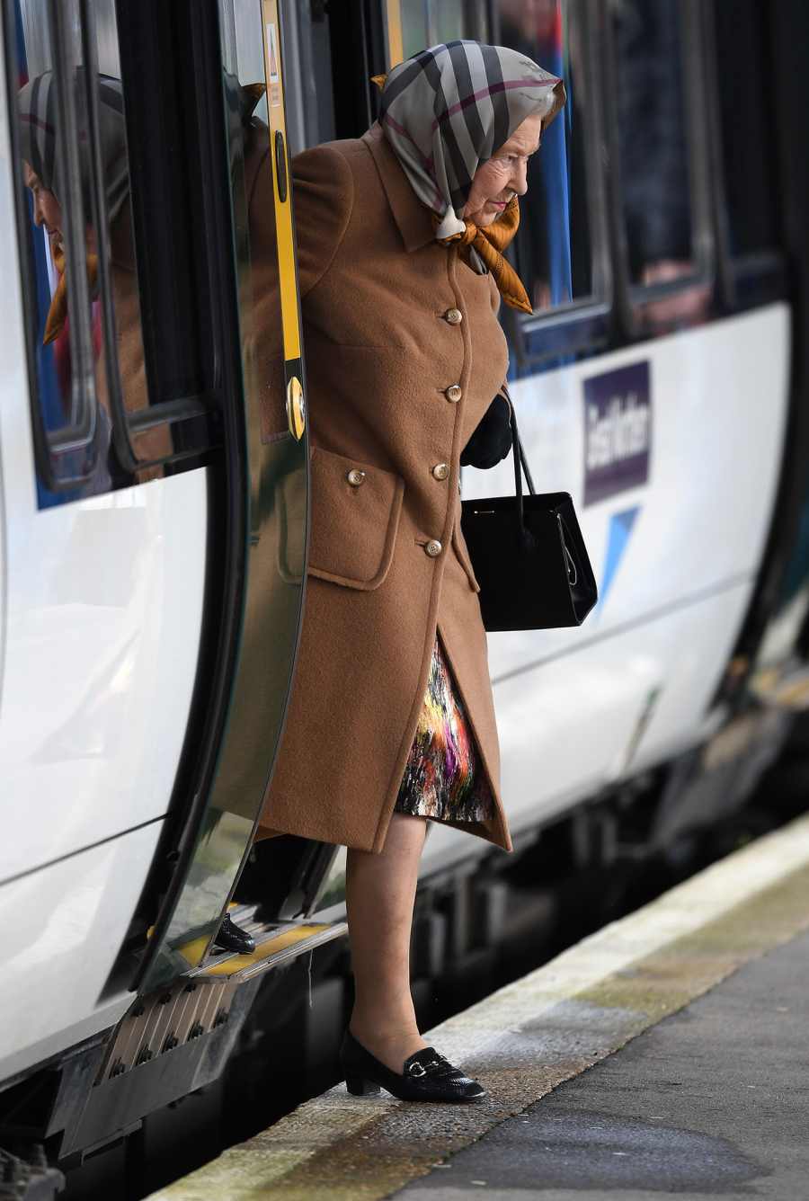 The Queen wraps up warm as she takes train to Norfolk for annual Christmas break