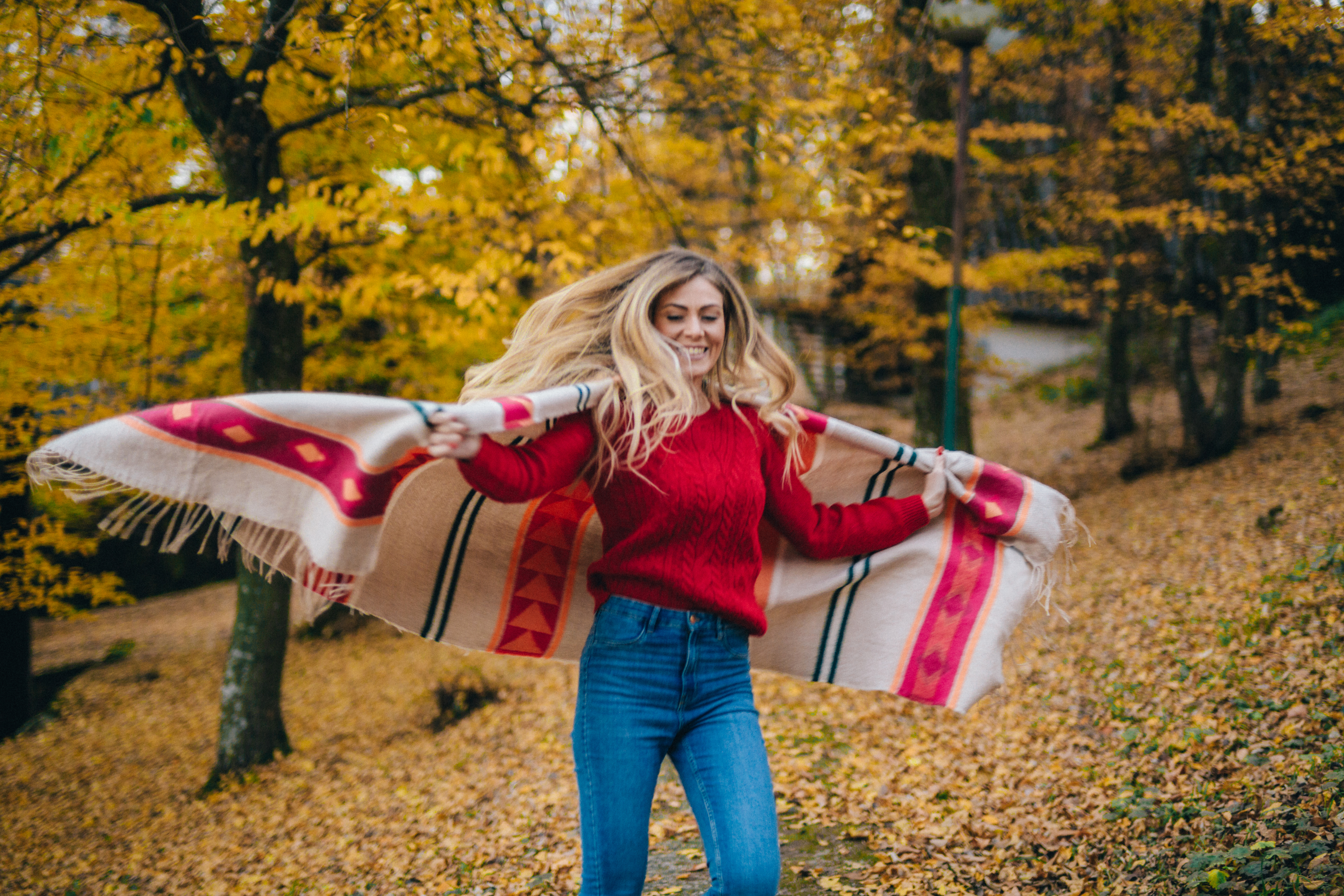 woman with a blanket in jeans
