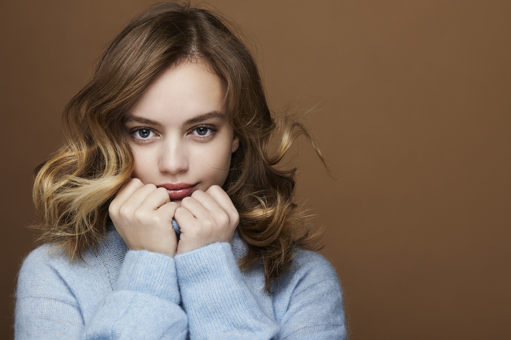young woman in a blue outfit