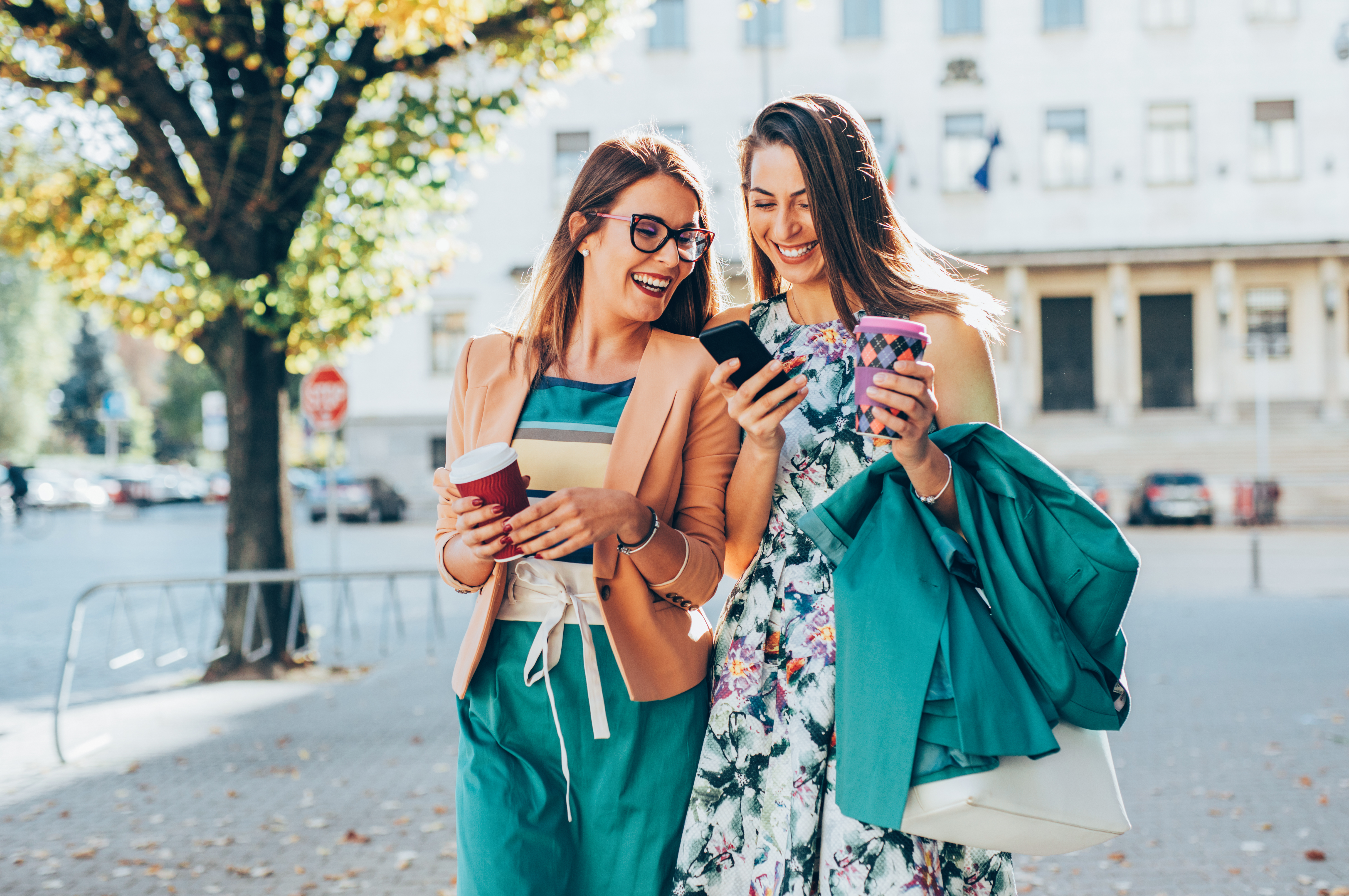 friends walking with shopping bags