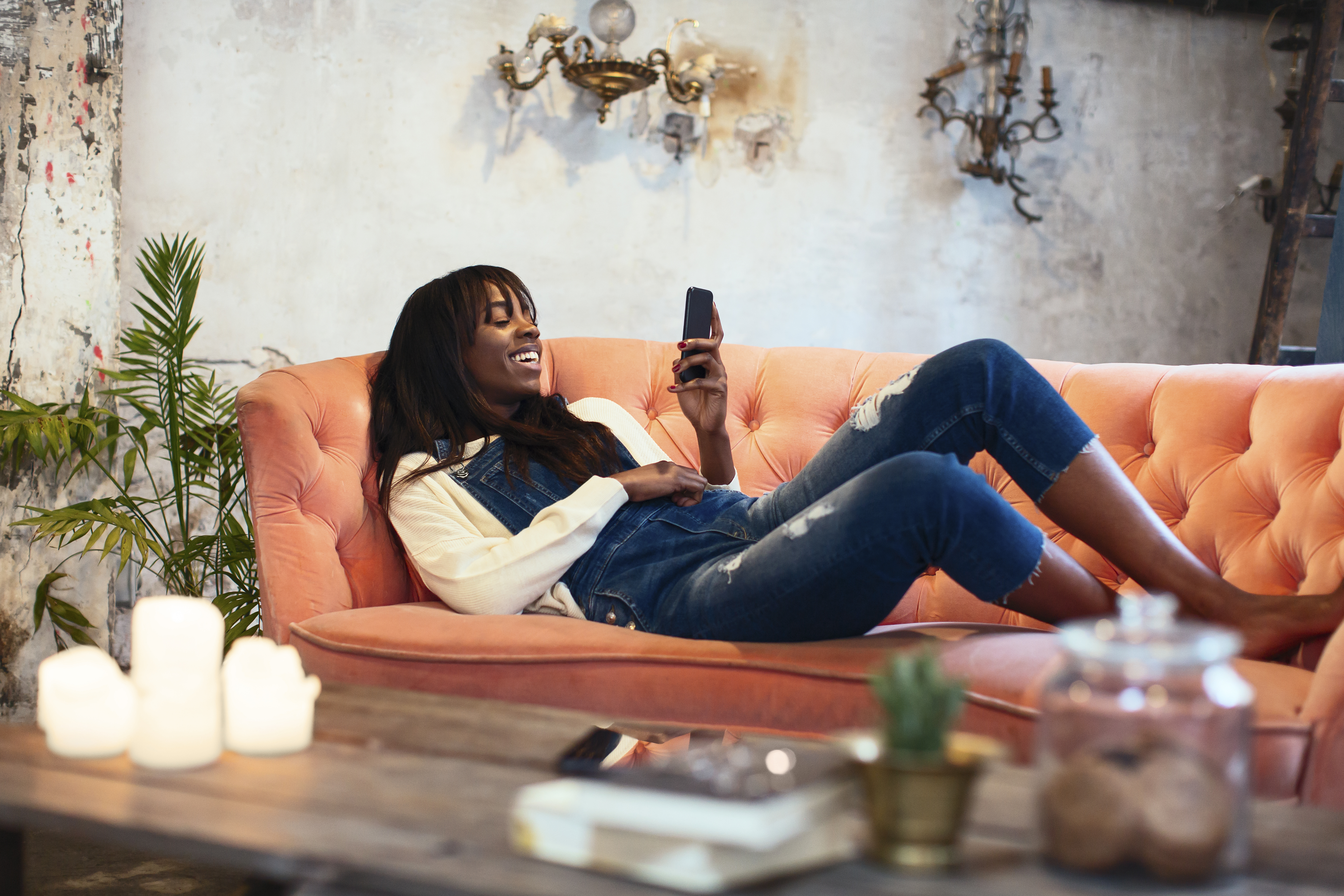 woman-on-couch-with-lit-candles