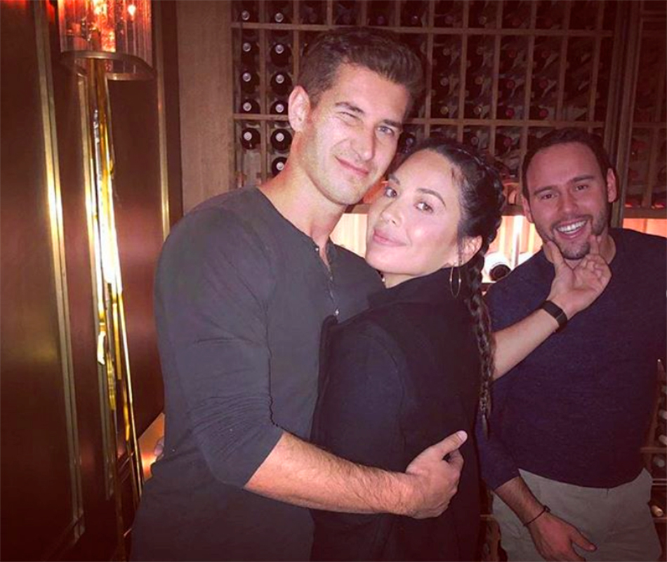 Olivia Munn and Tucker Roberts at Scooter Braun's New Year's Eve party.