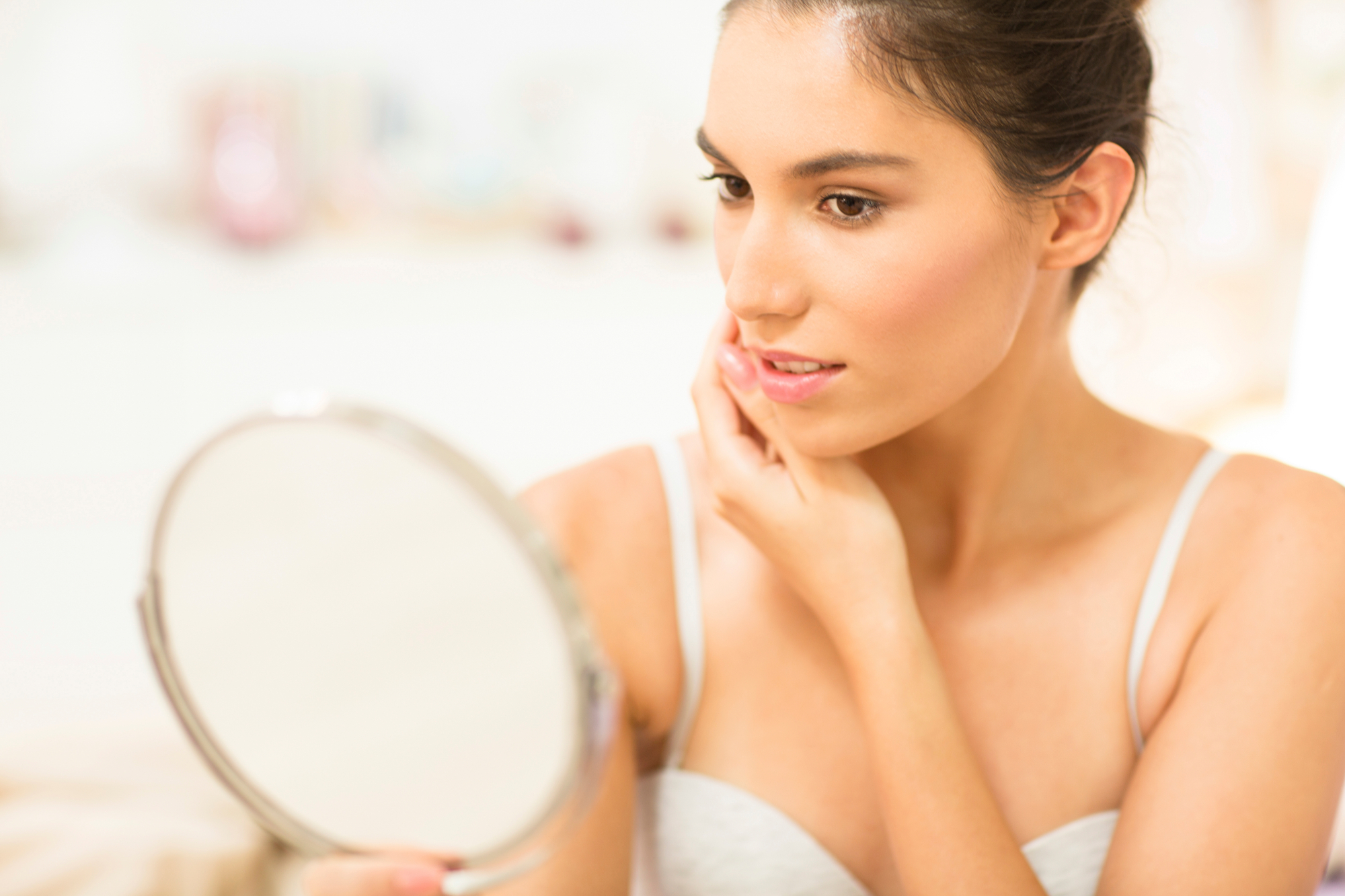 Woman Checking Skin