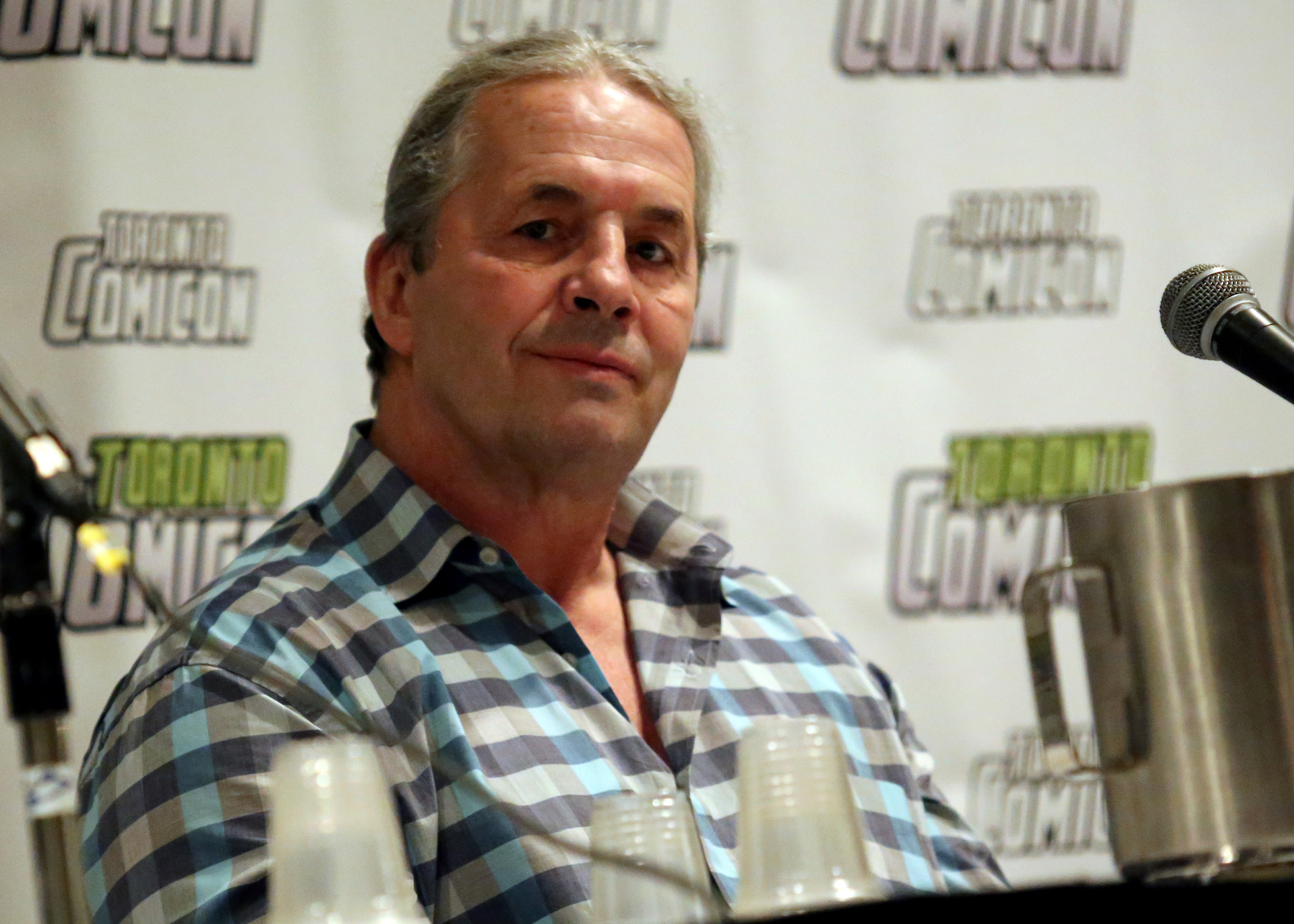 Wrestler Bret Hart Tackled By Fan Onstage at WWE Hall of Fame Ceremony