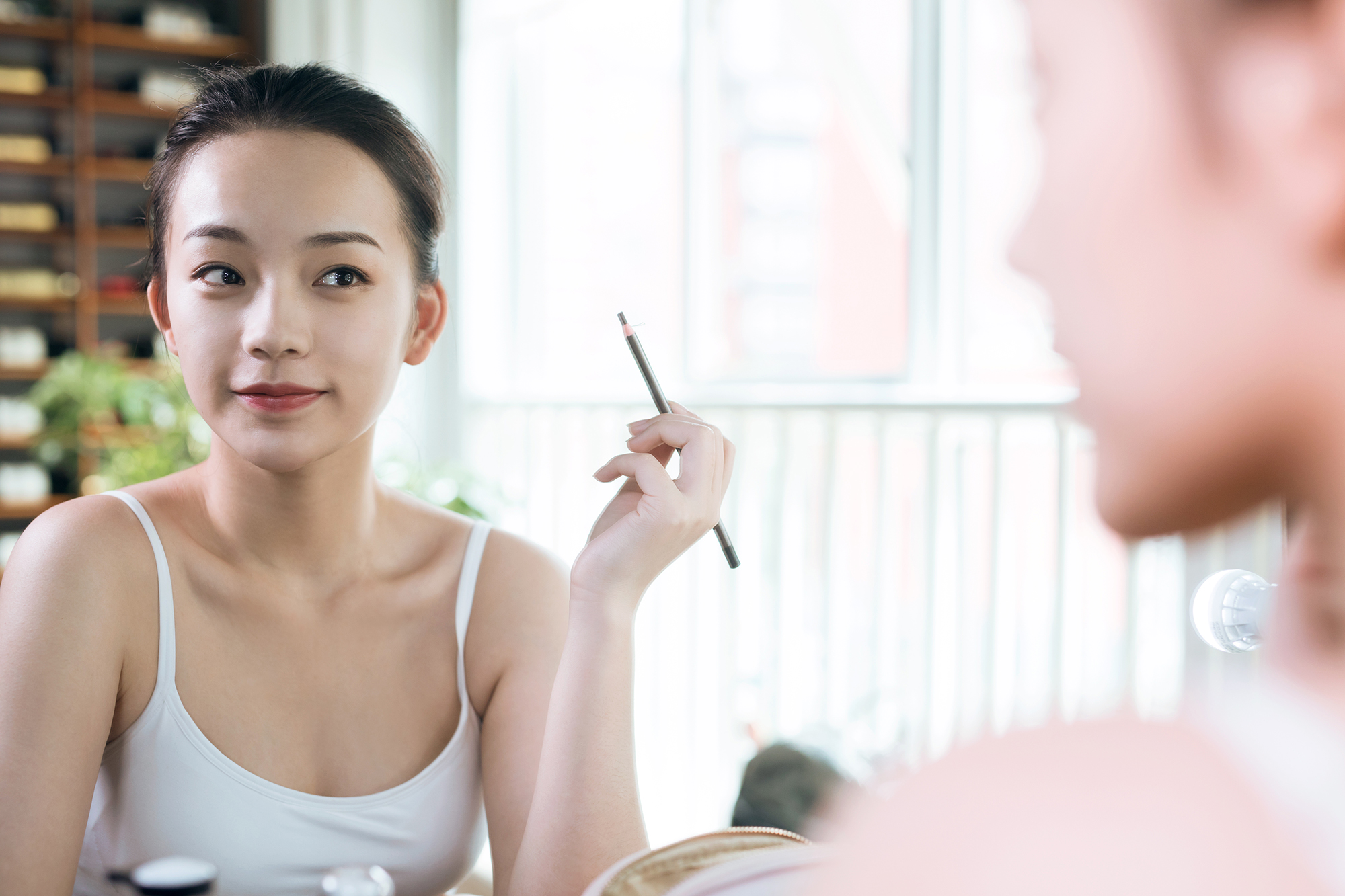 Woman Using Eye Pencil