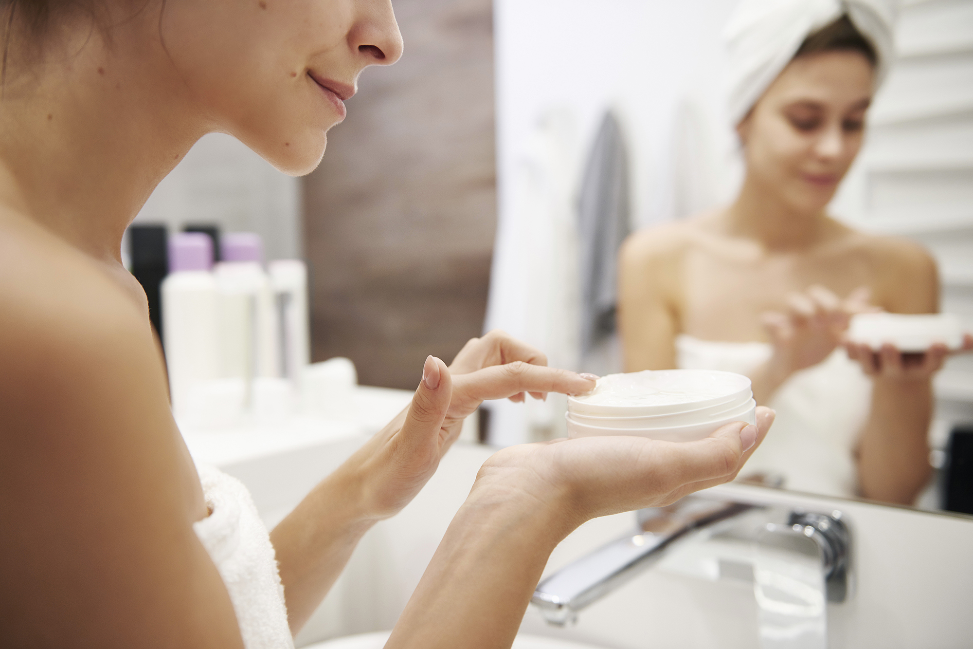 Woman Using Lotion