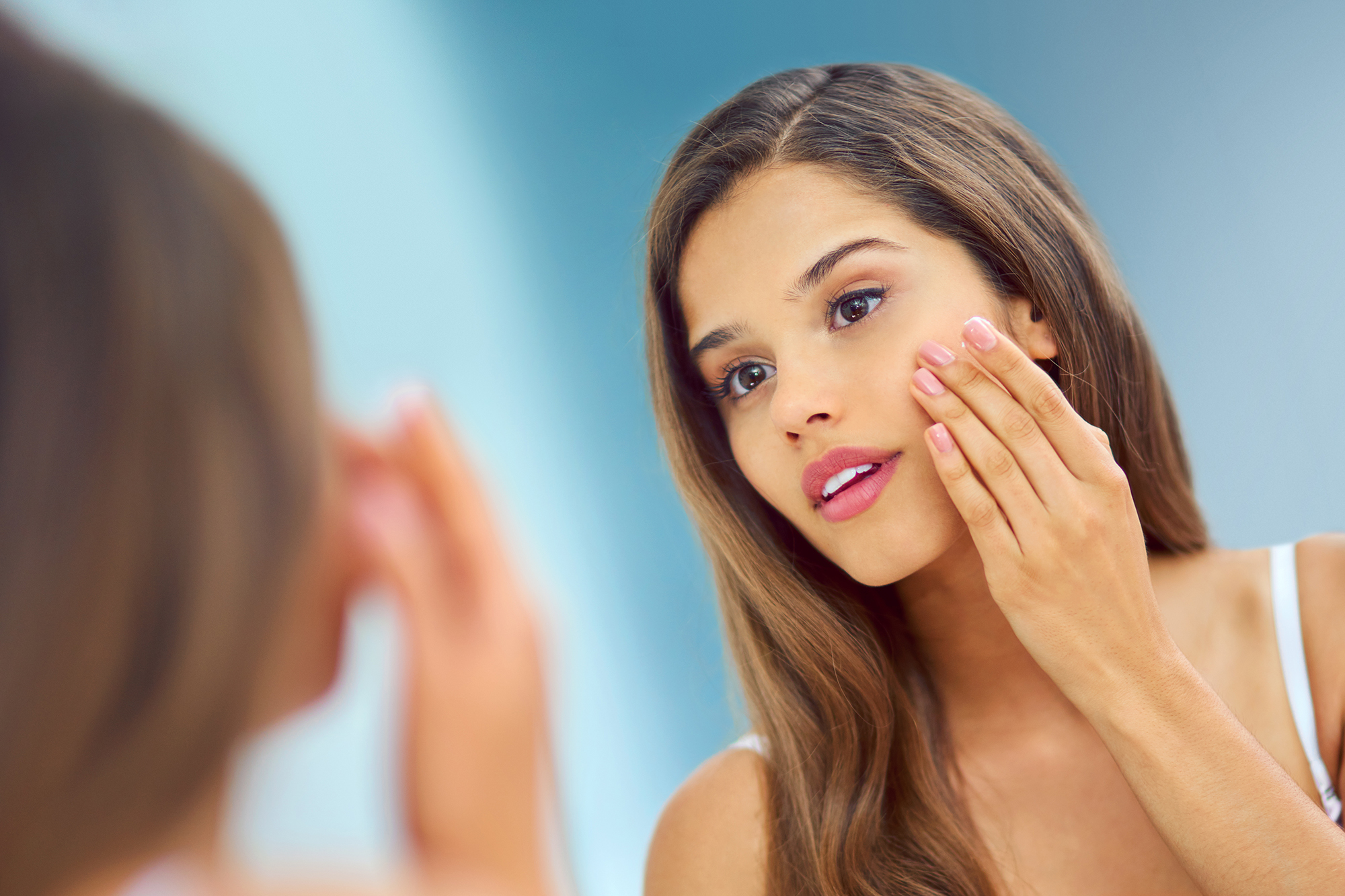 Woman Applying Skincare
