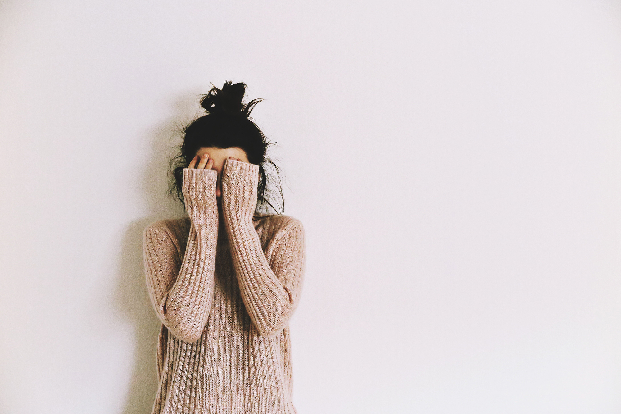 Woman Covering Face