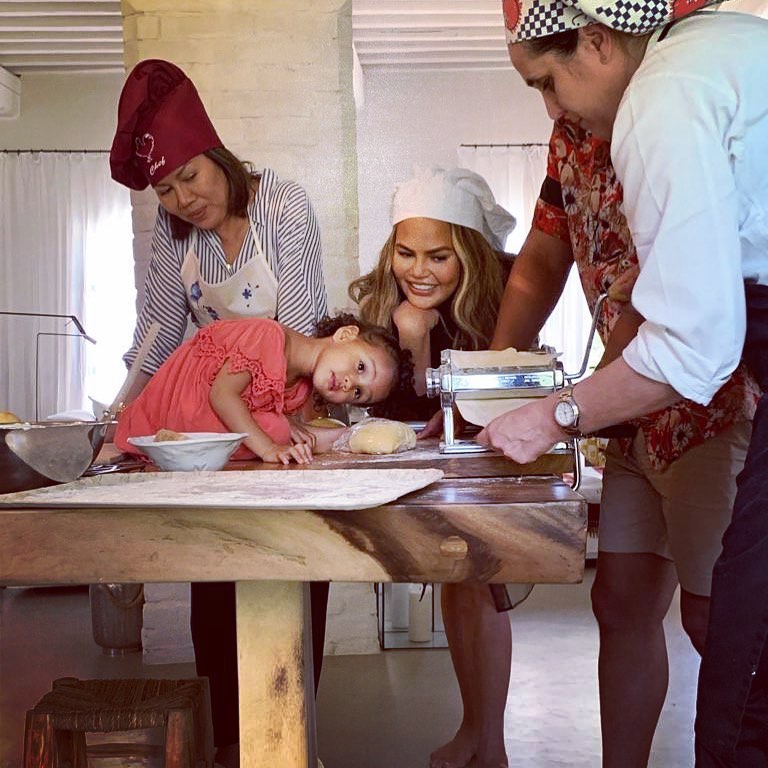 Chrissy Teigen and John Legend’s Summer Vacation Album With Luna and Miles Chrissy Teigen, Luna making Pasta