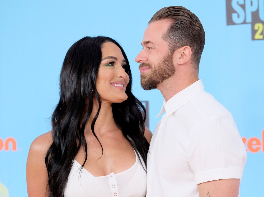 Artem-Chignitsev-Cradles-Pregnant-Nikki-Bella’s-Baby-Bump