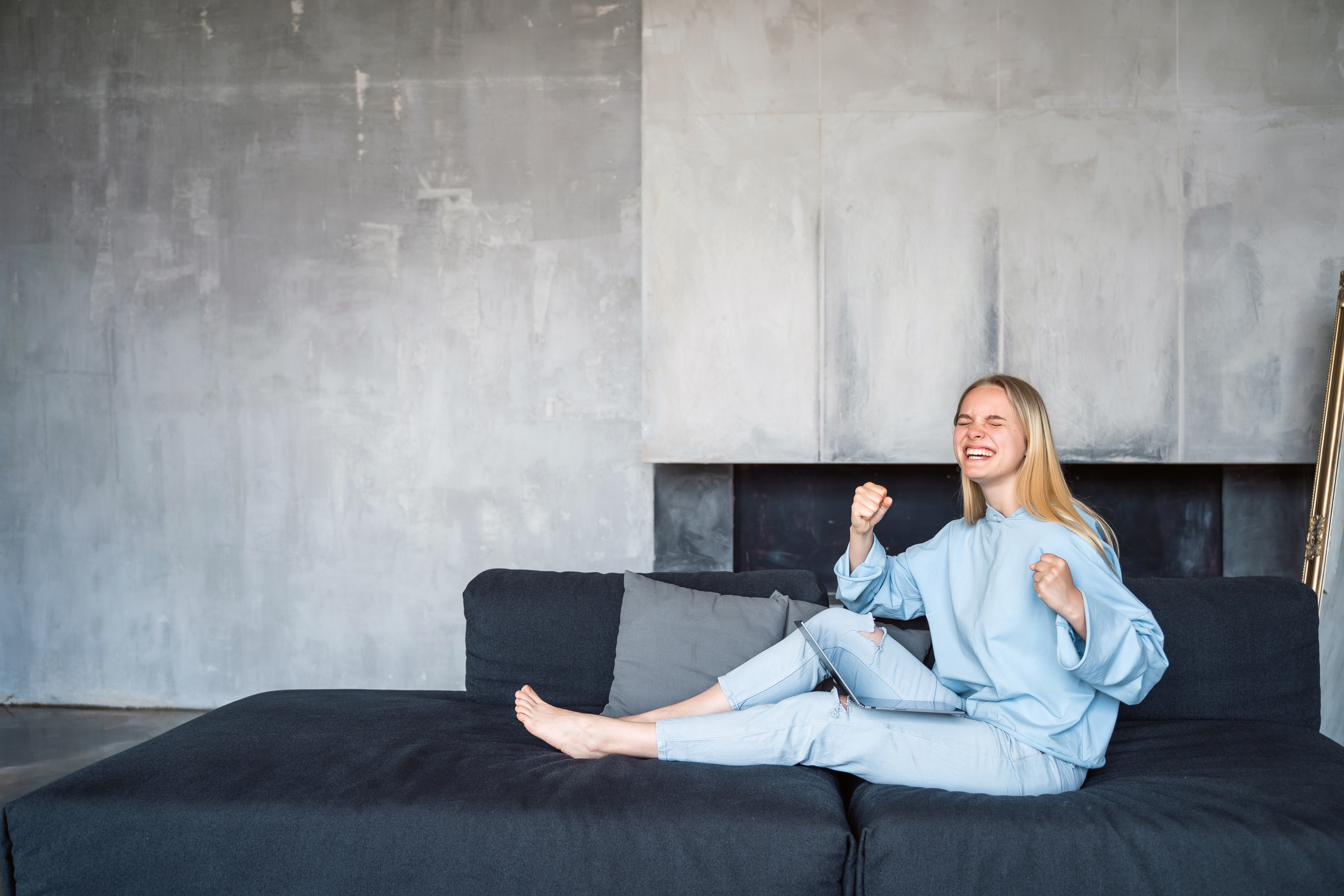 woman lounging on sofa