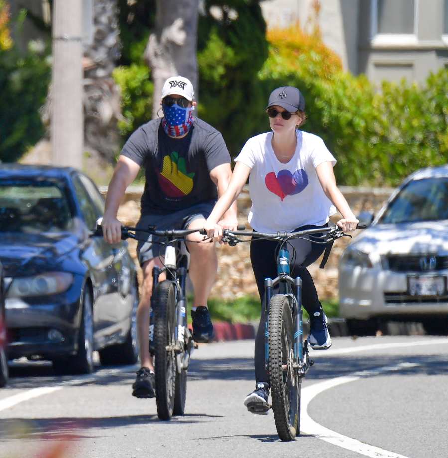 Pregnant Katherine Schwarzenegger Reveals Her Baby Bump on Bike Ride With Chris Pratt