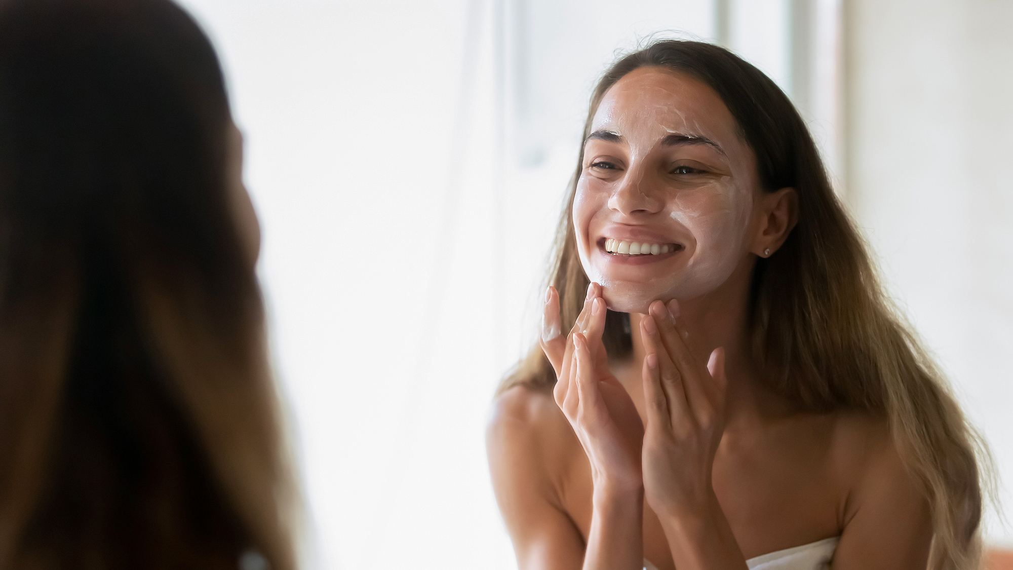 woman-cleansing-face