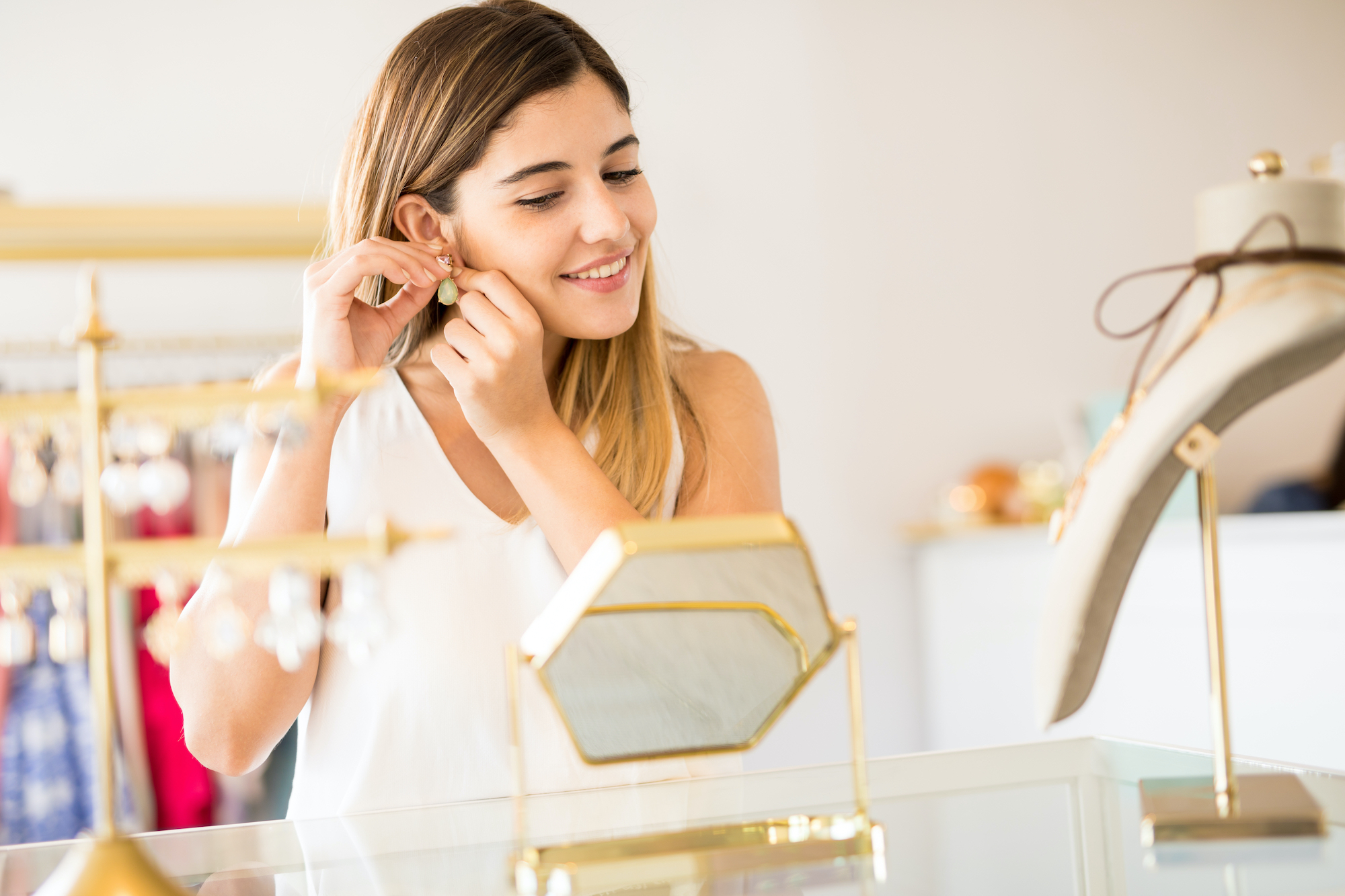 Woman-Trying-On-Jewelry-Stock-Photo