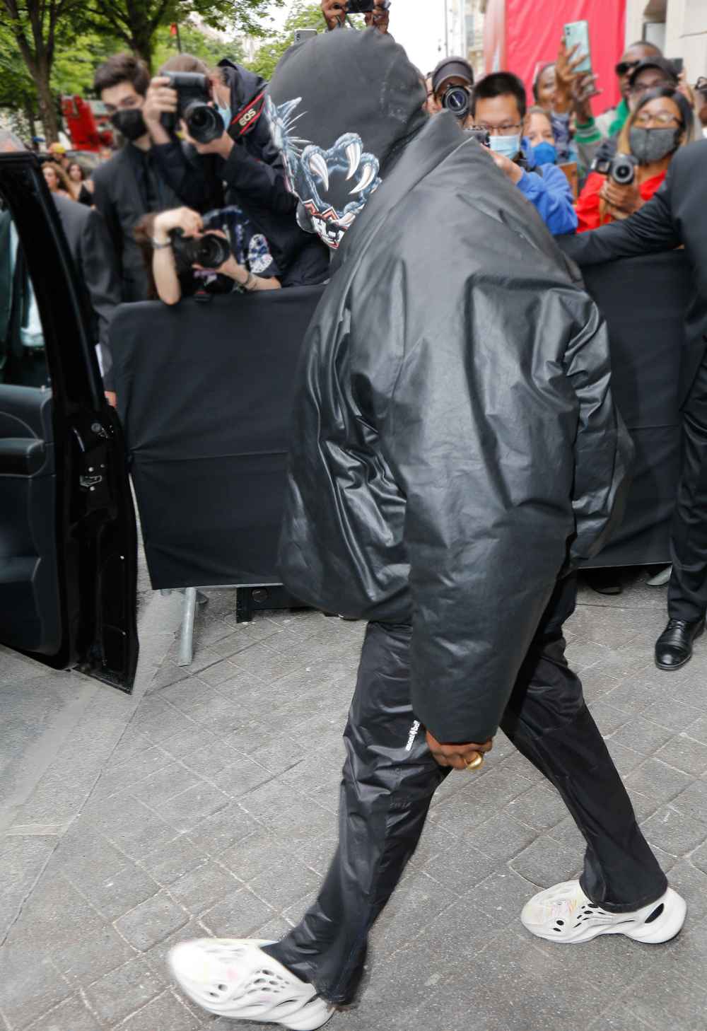 Kanye West Attends Balenciaga Fashion Show in Full Face Covering