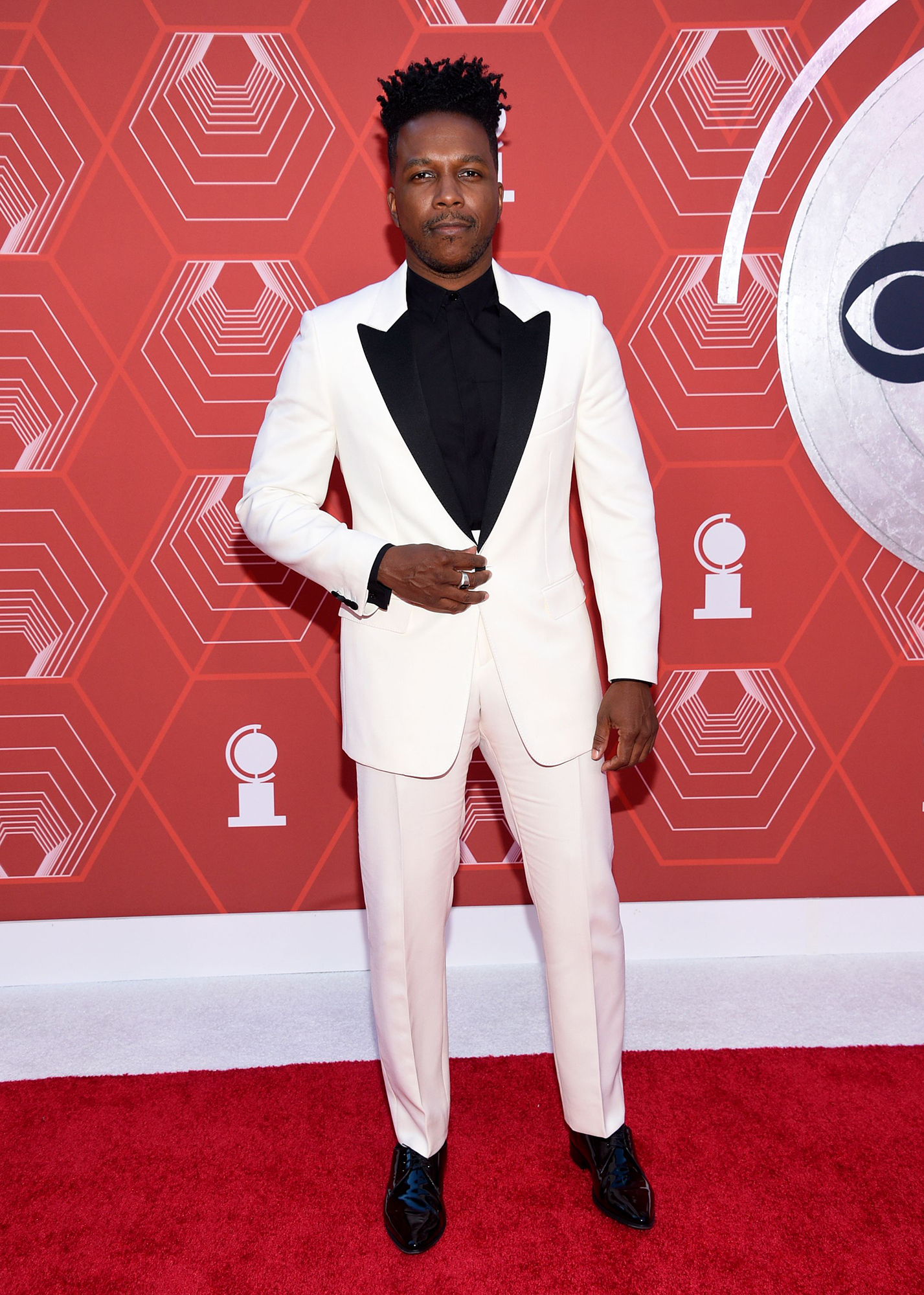 Leslie Odom Jr poses on the red carpet at the Tony Awards