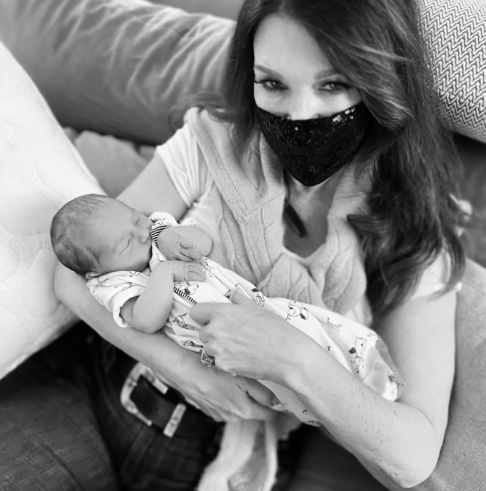 Lisa Vanderpump holds her grandson Theodore after daughter Pandora gave birth.