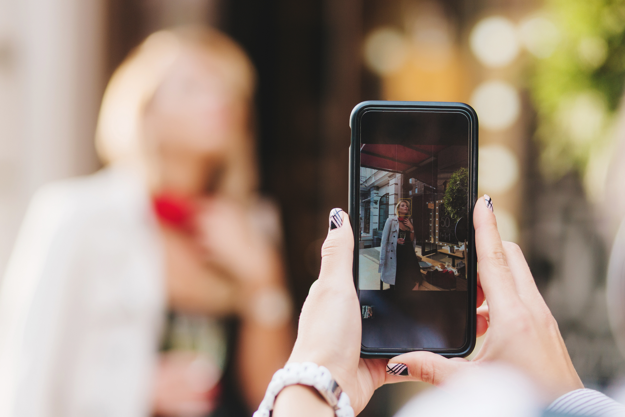 Woman-Taking-Instagram-Photo-Stock-Image