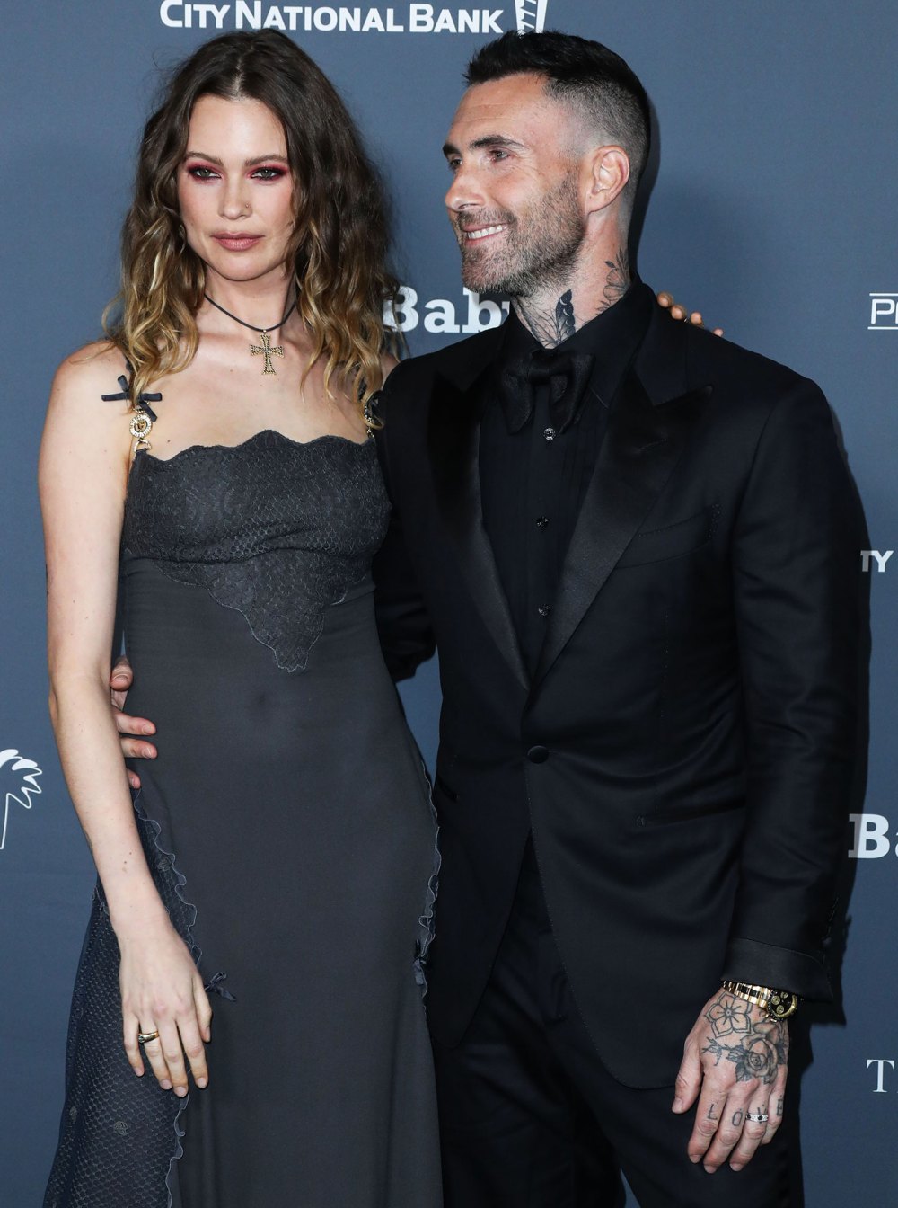 Behati Prinsloo Shows Support for Husband Adam Levine After Cheating Scandal: Details grey dress