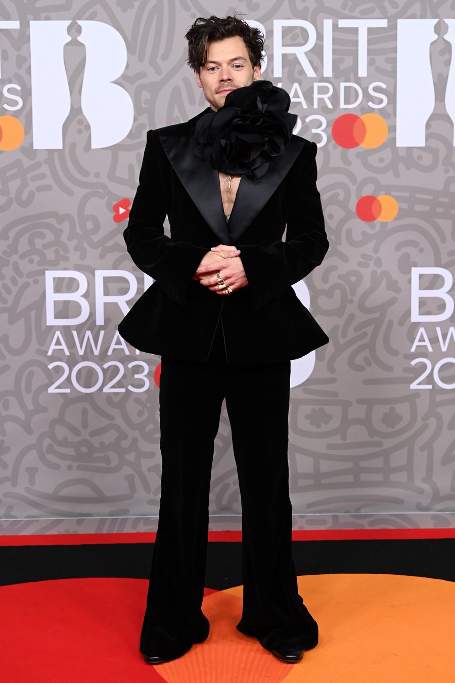 Harry Styles Wears Giant Flower Choker on 2023 Brit Awards Red Carpet: See Photos