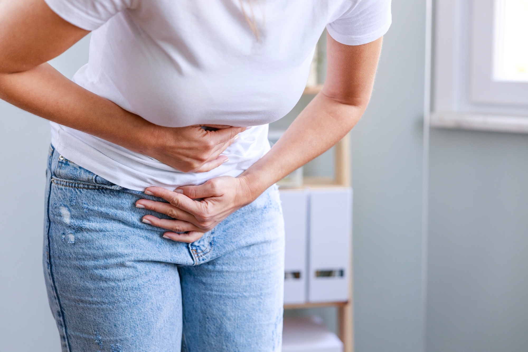 Young-Woman-Experiencing-Bloating-Stock-Photo