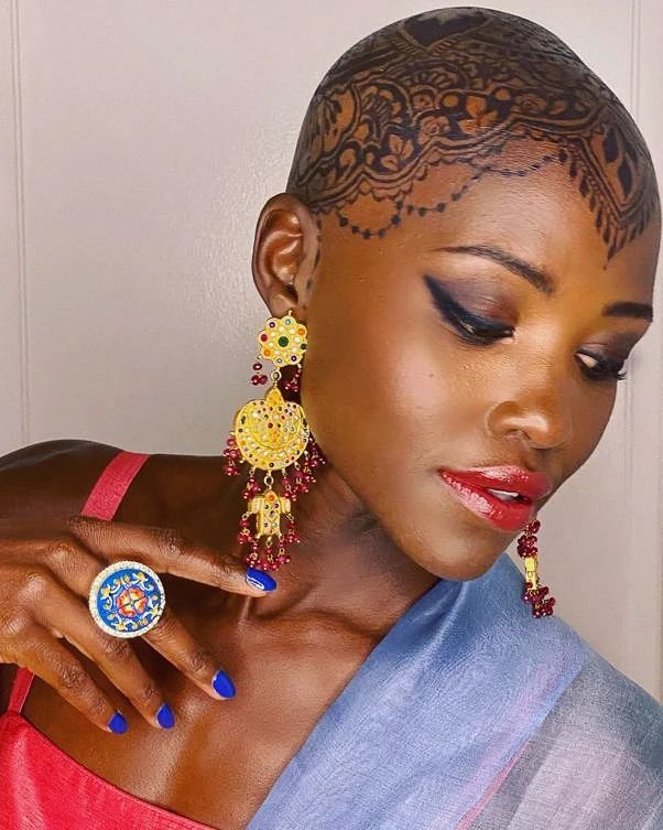 Lupita Nyong-o Covers Head With Henna