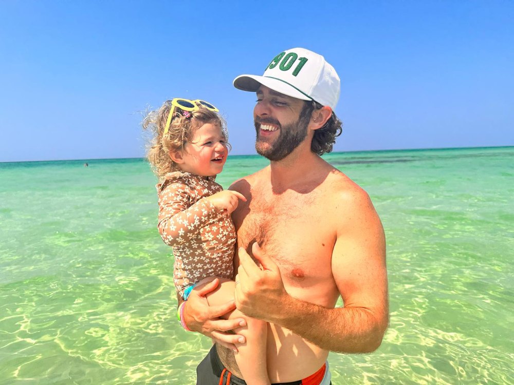 Shirtless Thomas Rhett Soaks Up Beach Time With Wife Lauren Akins and Their Youngest Daughter Lillie