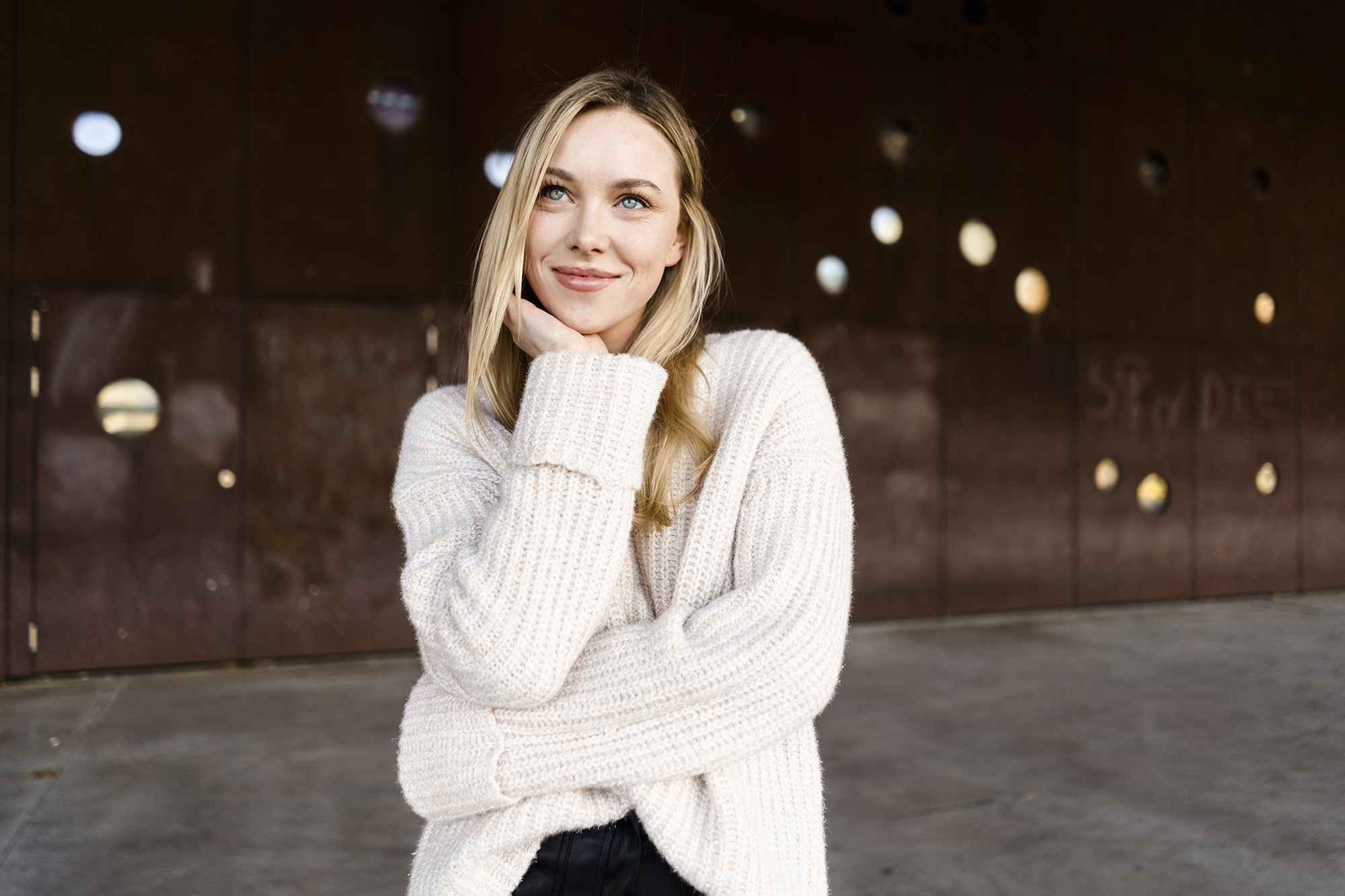 Portrait of smiling young woman outdoors