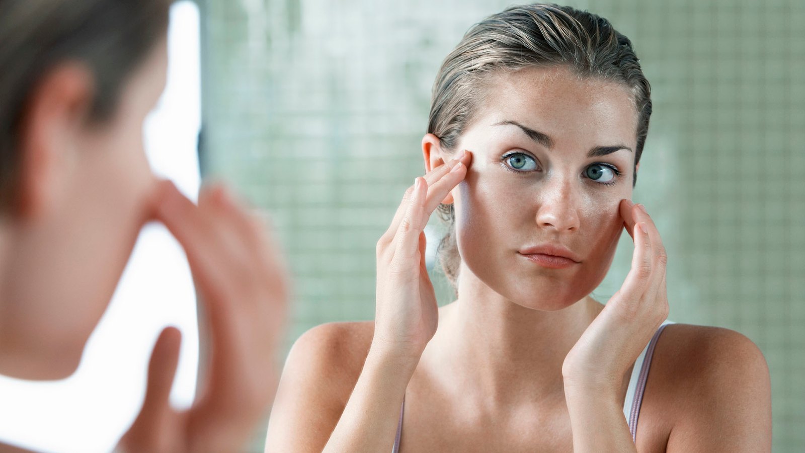 Woman Applying Facial Cream