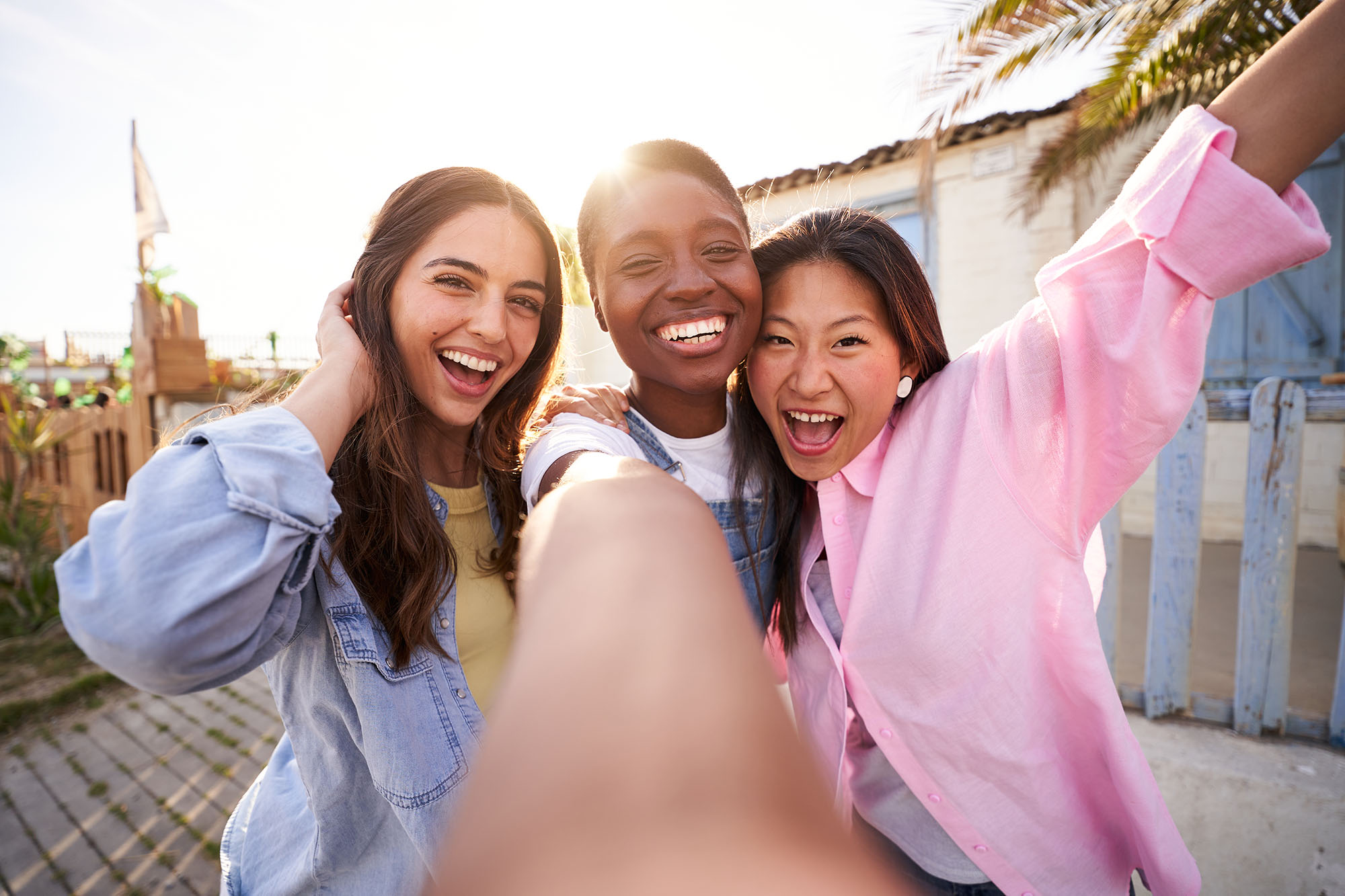 Three women taking selfie
