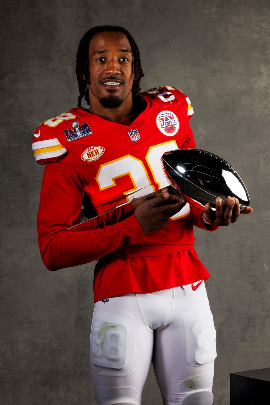 L'Jarius Sneed Kansas City Chiefs Players Kiss Vince Lombardi Trophy in Super Bowl LVIII Winners Portraits