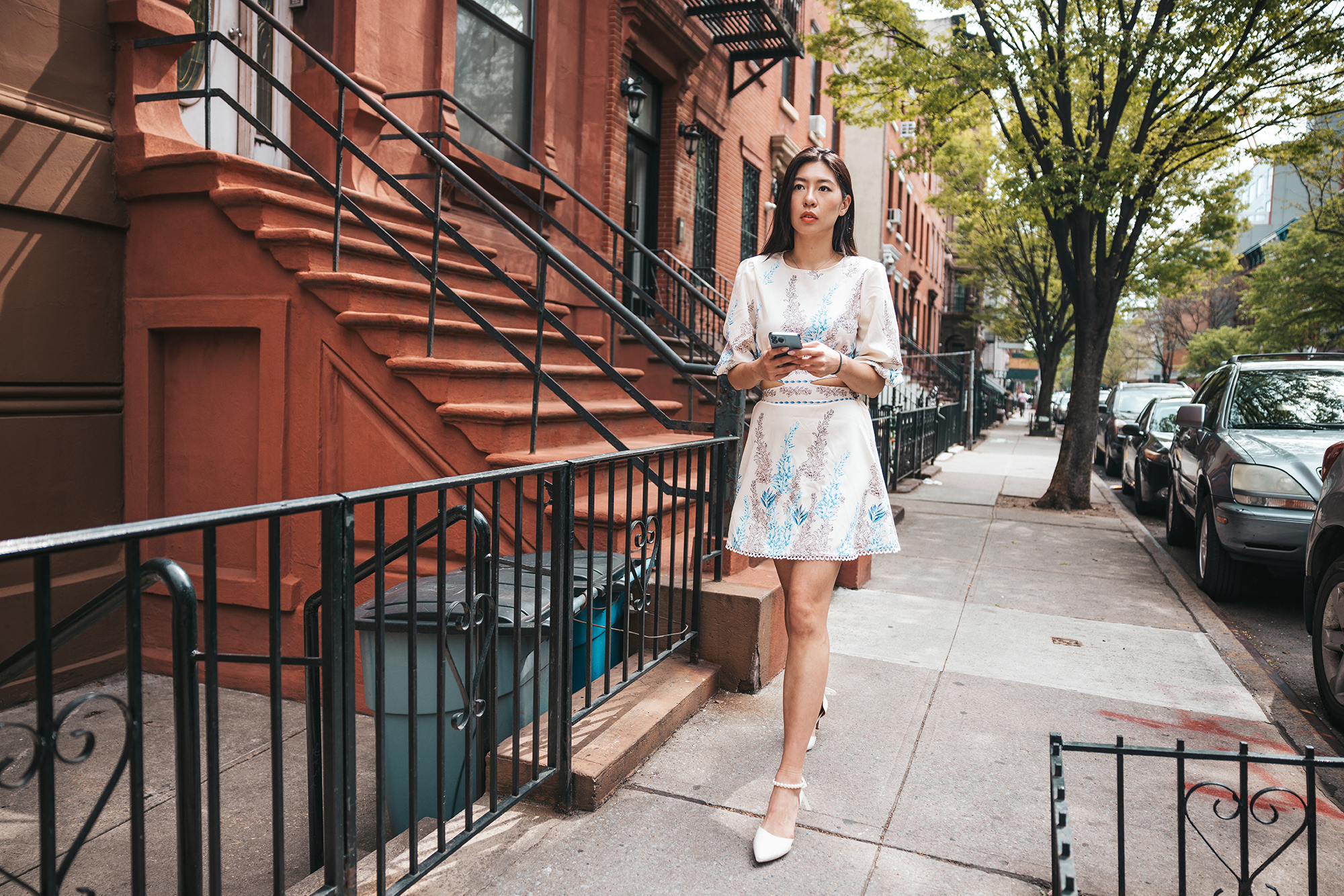 Young woman walking in the city street.