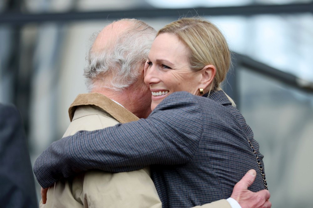 Excited Zara Tindall hugs King Charles during reunion