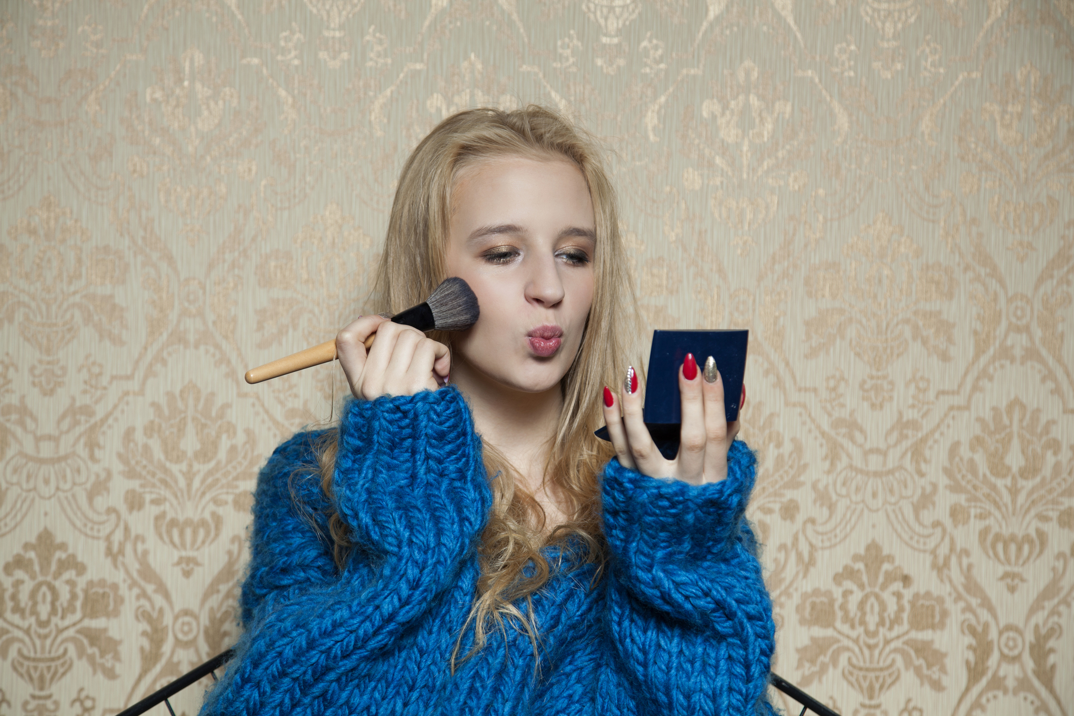 Woman applying makeup