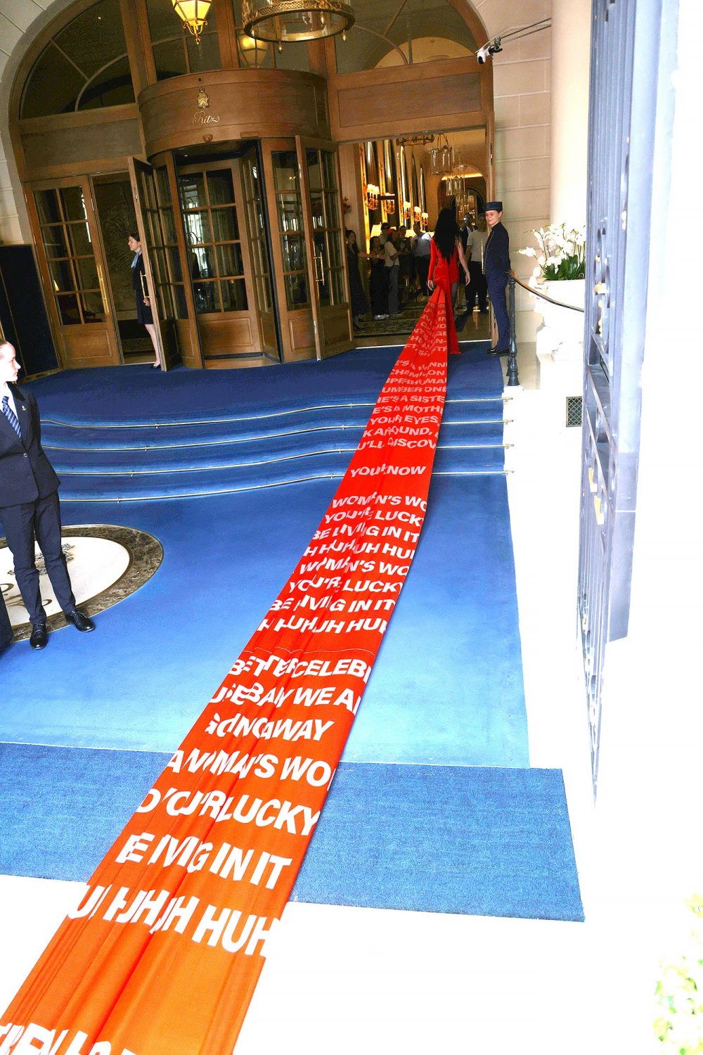 Katy Perry’s Paris Fashion Week Dress Has a 200-Foot-Long Train With The Lyrics to ‘Woman’s World’