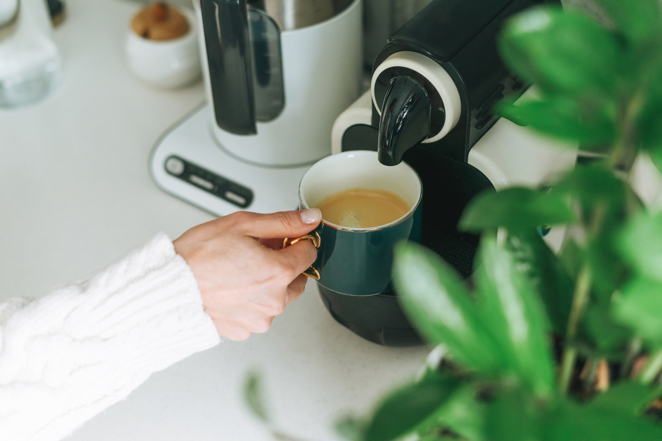 Pouring coffee from machine