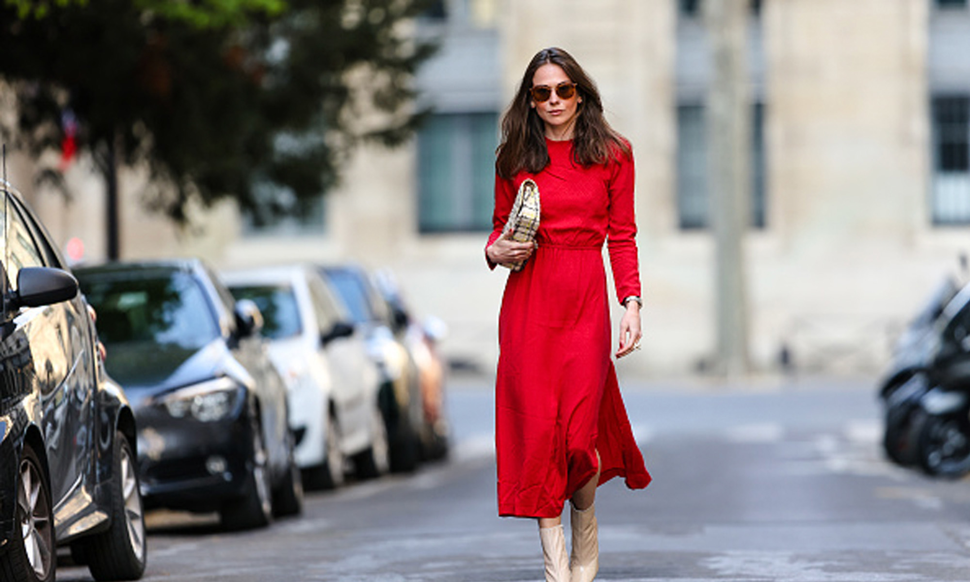 woman wearing red dress on street