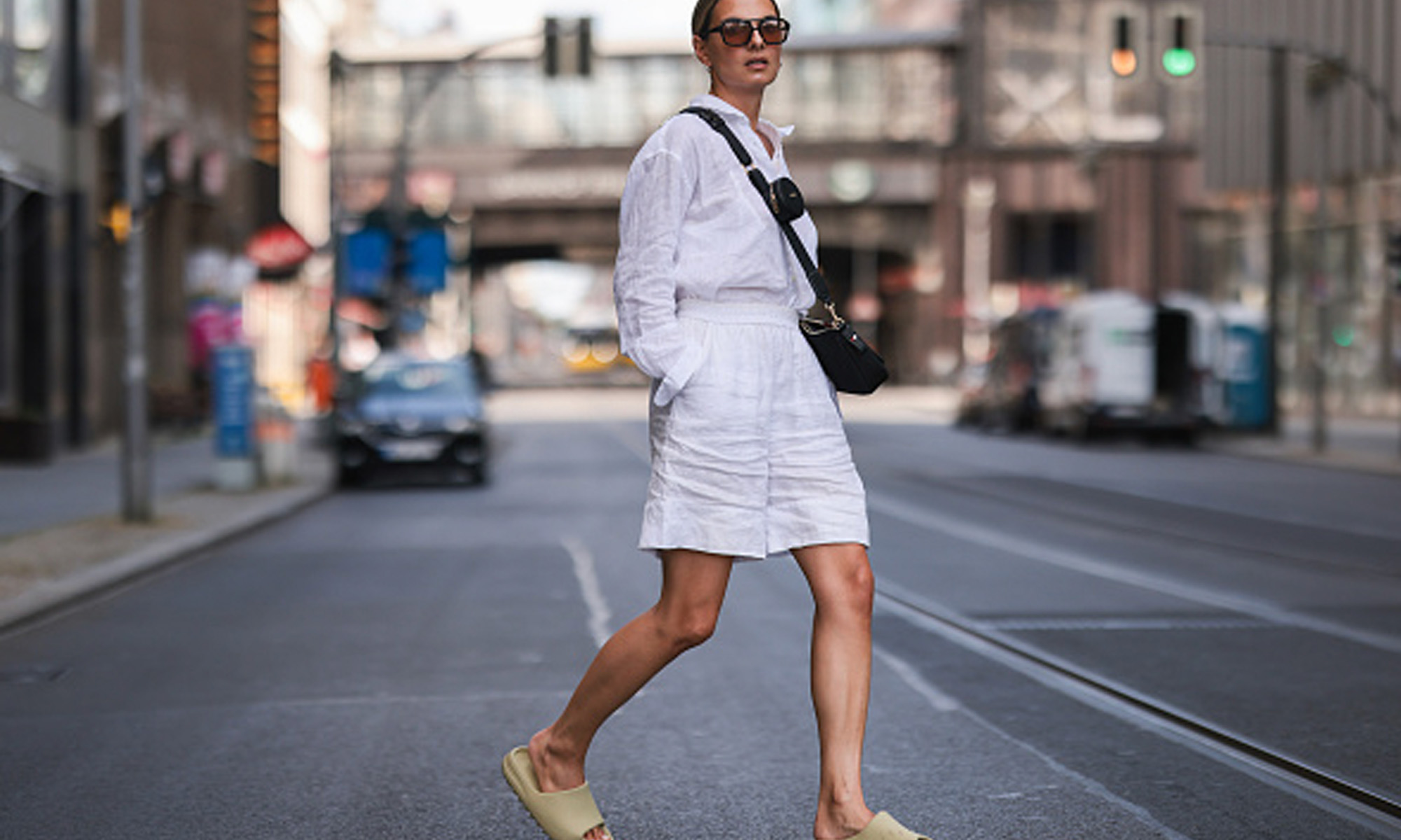 woman in white matching set walking